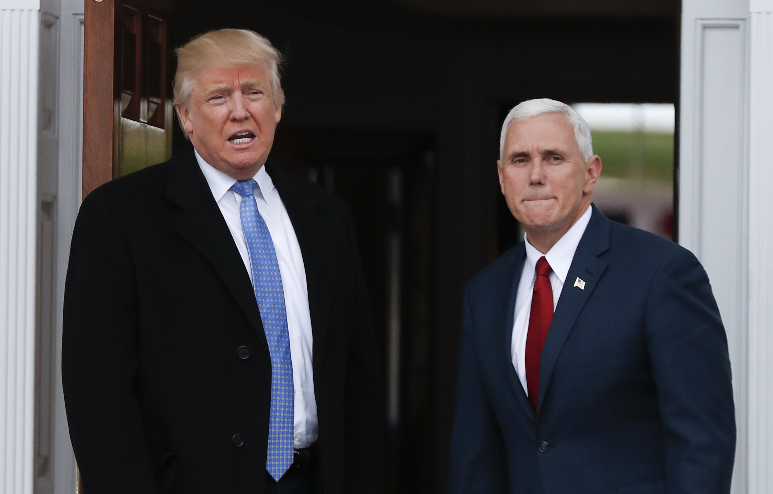 President-elect Donald Trump, left, talks to media as he and Vice President-elect Mike Pence arrive at the Trump National Golf Club Bedminster clubhouse, Sunday, Nov. 20, 2016 in Bedminster, N.J.. (AP Photo/Carolyn Kaster) (AP)