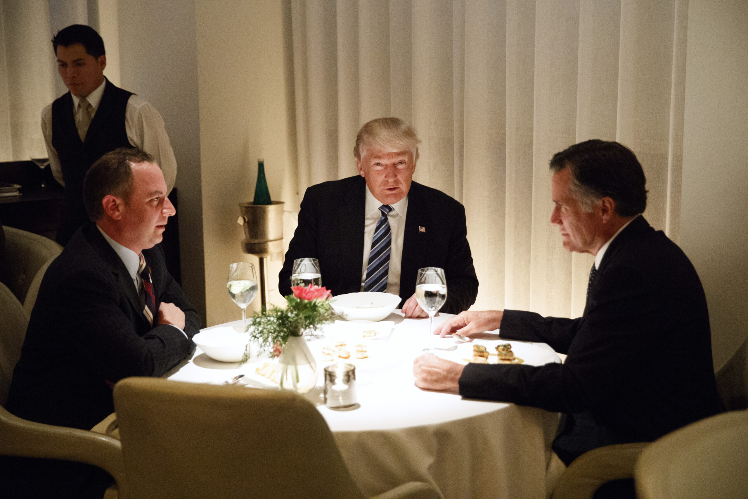 President-elect Donald Trump, center, eats dinner with Mitt Romney, right, and Trump Chief of Staff Reince Priebus at Jean-Georges restaurant, Tuesday, Nov. 29, 2016, in New York. (AP)