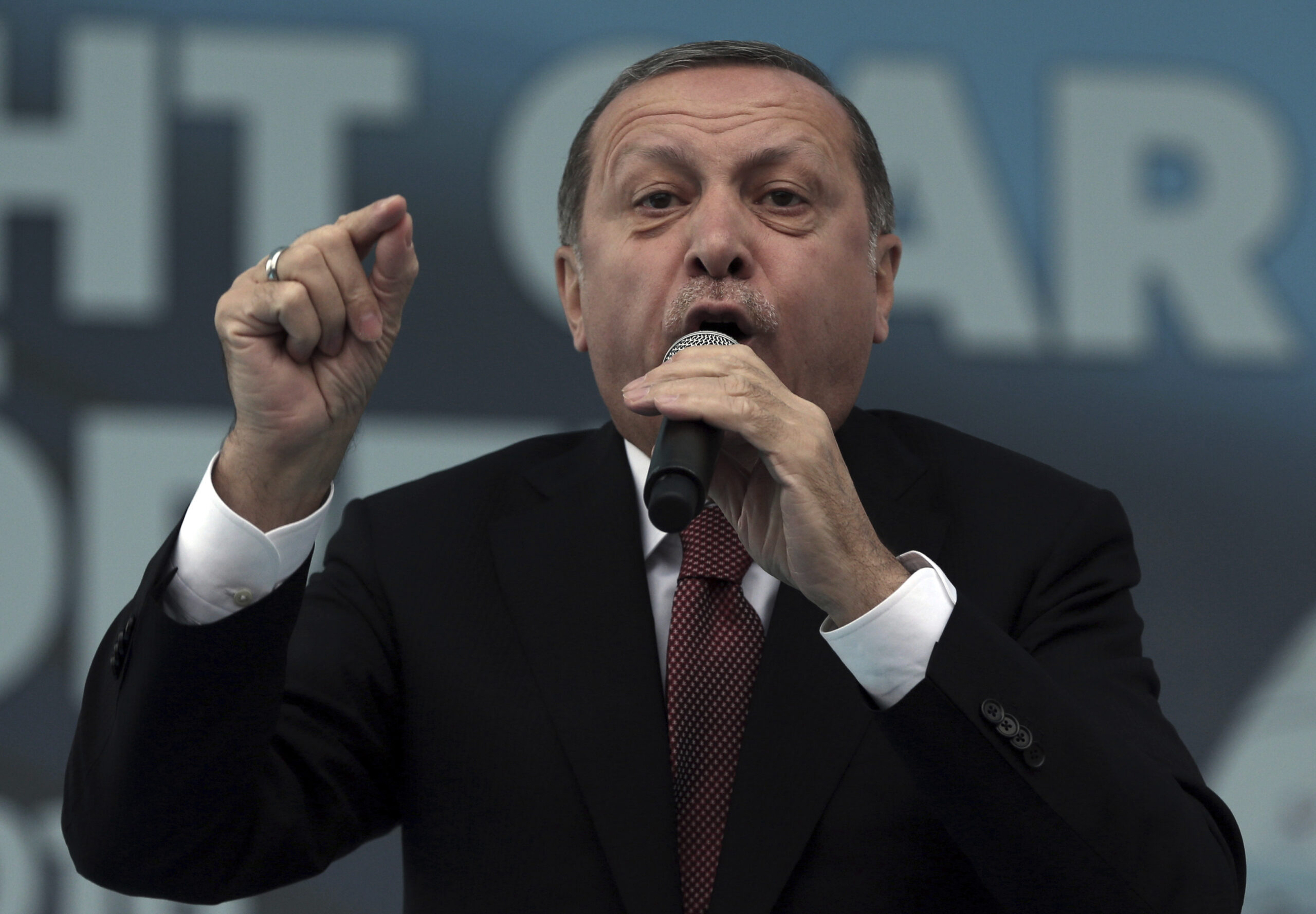 FILE - In this Oct. 29, 2016 file photo, Turkey's President Recep Tayyip Erdogan addresses his supporters during a ceremony for a new train station building on the Republic Day in Ankara, Turkey. Since quashing a July coup attempt, Turkey’s president has used extraordinary powers from a state of emergency to arrest and purge thousands of opponents. Recep Tayyip Erdogan has also vowed to back public demands to reinstate the death penalty and suggested submitting Turkey's long-sought goal of European Union membership to a referendum. (AP Photo/Burhan Ozbilici, File) (AP)