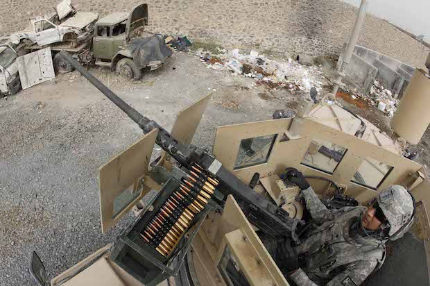 A U.S. soldier outside the entrance of Sarpoza prison in Kandahar city, Afghanistan, August 24, 2010 (Reuters/Oleg Popov)