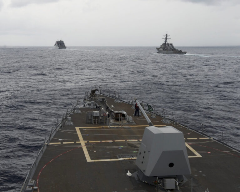FILE - This Oct. 17, 2016 file image provided by the U.S. Navy,  shows the guided missile destroyer USS Decatur, right, pulling into position behind the Military Sealift Command USNS Matthew Perry, during a replenishment-at-sea, seen from the bridge of the guided-missile destroyer USS Spruance, in the South China Sea. The commander of U.S. forces in the Pacific Adm. Harry Harris said he’s concerned with China’s assertiveness in the South China Sea and the East China Sea as he headed to the Philippines to discuss the next round of joint exercises. (U.S. Navy/Petty Officer 2nd Class Will Gaskill via AP, File) (AP)