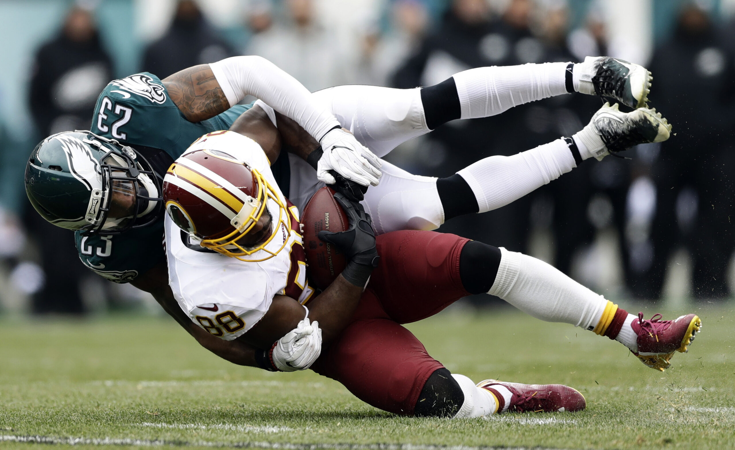 Washington Redskins' Pierre Garcon (88) is brought down by Philadelphia Eagles' Rodney McLeod (23) during the first half of an NFL football game, Sunday, Dec. 11, 2016, in Philadelphia. (AP Photo/Matt Rourke) (AP)