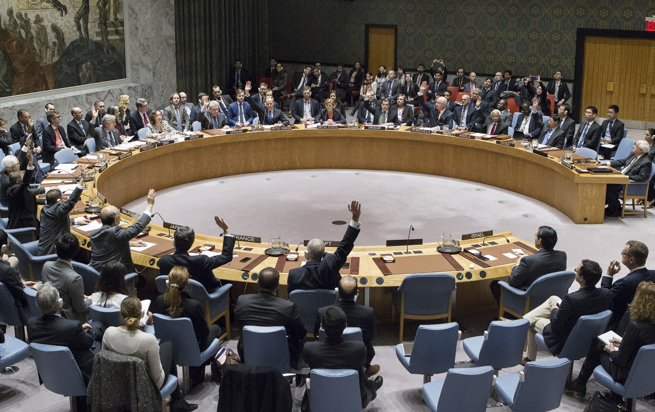 In this photo provided by the United Nations, members of the United Nations Security council vote at the United Nations headquarters on Friday, Dec. 23, 2016, in favor of condemning Israel for its practice of establishing settlements in the West Bank and east Jerusalem. (AP)