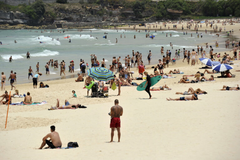 In this Tuesday, Dec. 13, 2016 photo, people gather on the sand at Bondi Beach in Sydney, Australia. Sydney residents sweltered through the city's second hottest night on record and its hottest December night in 148 years, with many cooling off at beaches long after dark. A minimum of 27.1 degrees Celsius (80.8 degrees Fahrenheit) was recorded in Australia's largest city early Wednesday, Australian Bureau of Meteorology forecaster Jordan Notara said. () (Joel Carrett/AAP Image via AP)