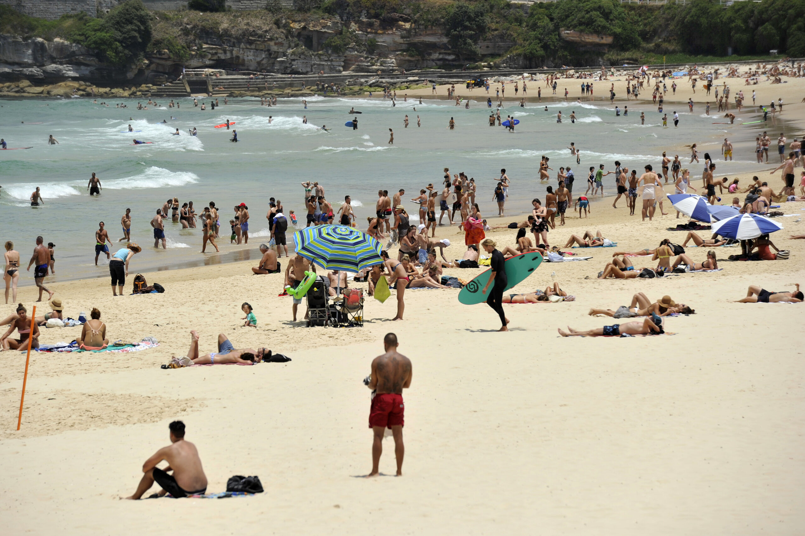 In this Tuesday, Dec. 13, 2016 photo, people gather on the sand at Bondi Beach in Sydney, Australia. Sydney residents sweltered through the city's second hottest night on record and its hottest December night in 148 years, with many cooling off at beaches long after dark. A minimum of 27.1 degrees Celsius (80.8 degrees Fahrenheit) was recorded in Australia's largest city early Wednesday, Australian Bureau of Meteorology forecaster Jordan Notara said. () (Joel Carrett/AAP Image via AP)