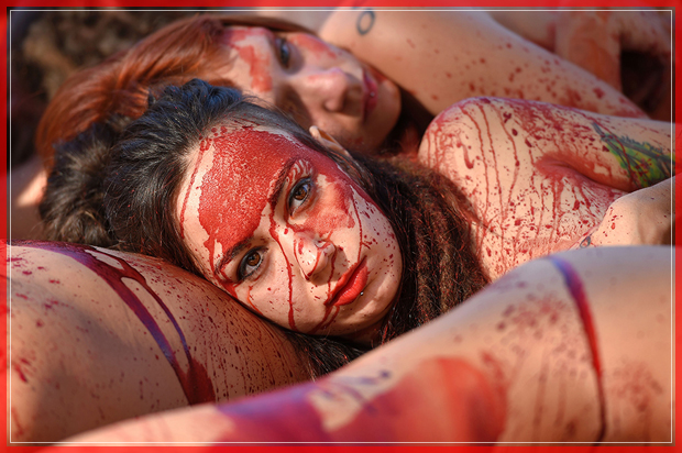 Naked activists of the animal-rights group "AnimaNaturalis" covered with fake blood stage a protest to denounce the use of animal skins, in Barcelona on December 11, 2016. / AFP / LLUIS GENE        (Photo credit should read LLUIS GENE/AFP/Getty Images) (Afp/getty Images)