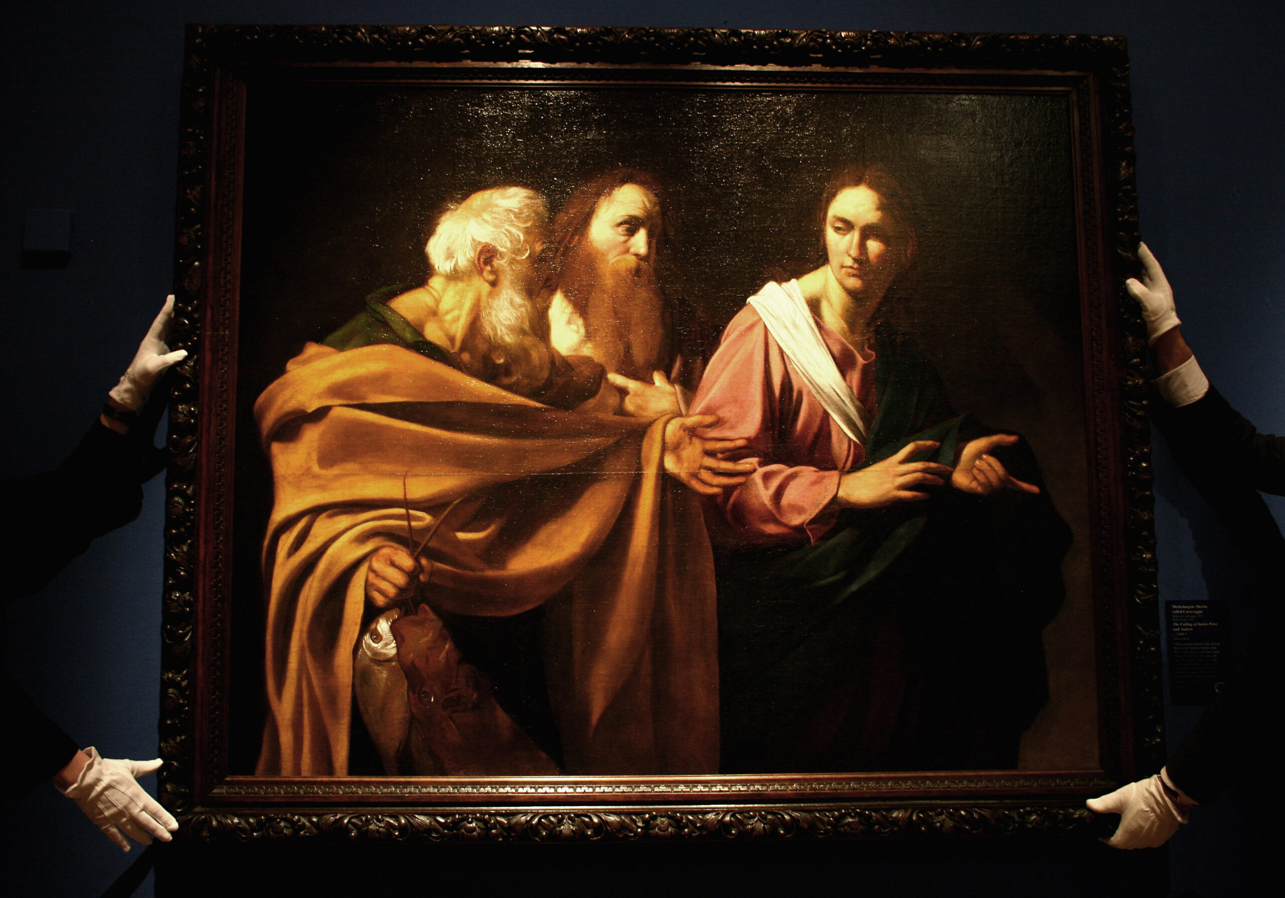 EDINBURGH, UNITED KINGDOM - NOVEMBER 12:  Staff at The Queen?s Gallery at the Palace of Holyrood view The Calling of Saints Peter and Andrew by Caravaggio on November 12, 2008 in Edinburgh, Scotland.The painting is one of two lost works which were discovered in the Queens collection, it hangs along side Boy Peeling Fruit, and it is on display for the first time in Scotland, as part of The Art of Italy in the Royal Collection.  (Photo by Jeff J Mitchell/Getty Images) (Getty/Jeff J Mitchell)
