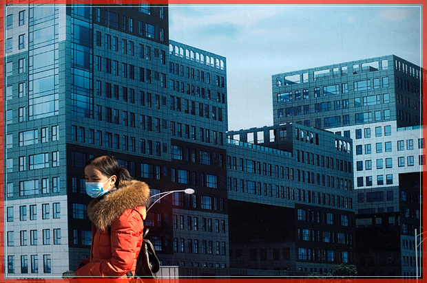 A woman wearing a mask walks in front of a property advertisement billboard in Beijing on December 9, 2016.
The consumer price index, a key gauge of retail inflation, rose 2.3 percent in November, slightly beating expectations of 2.2 percent, according to figures released by Beijing on December 9. / AFP / NICOLAS ASFOURI        (Photo credit should read NICOLAS ASFOURI/AFP/Getty Images) (Afp/getty Images)