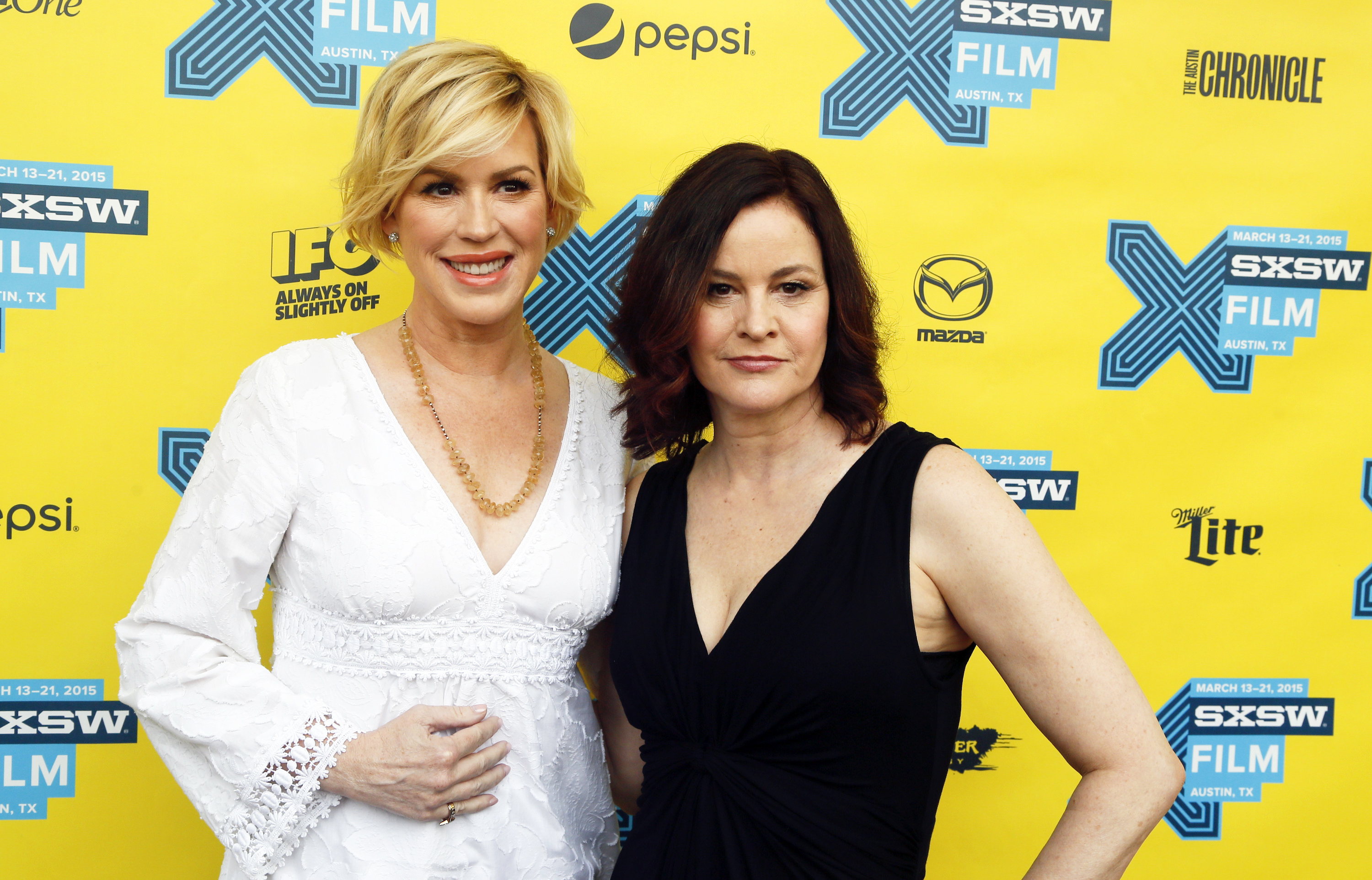 FILE - In this March 16, 2015 file photo, Molly Ringwald, left, and Ally Sheedy walk the red carpet for "The Breakfast Club" 30th Anniversary Restoration World Premiere during the South by Southwest Film Festival in Austin, Texas. (Jack Plunkett/invision/ap)