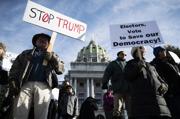 Protesters demonstrate ahead of Pennsylvania's 58th Electoral College at the state Capitol in Harrisburg, Pa., Monday, Dec. 19, 2016. (AP/Matt Rourke)