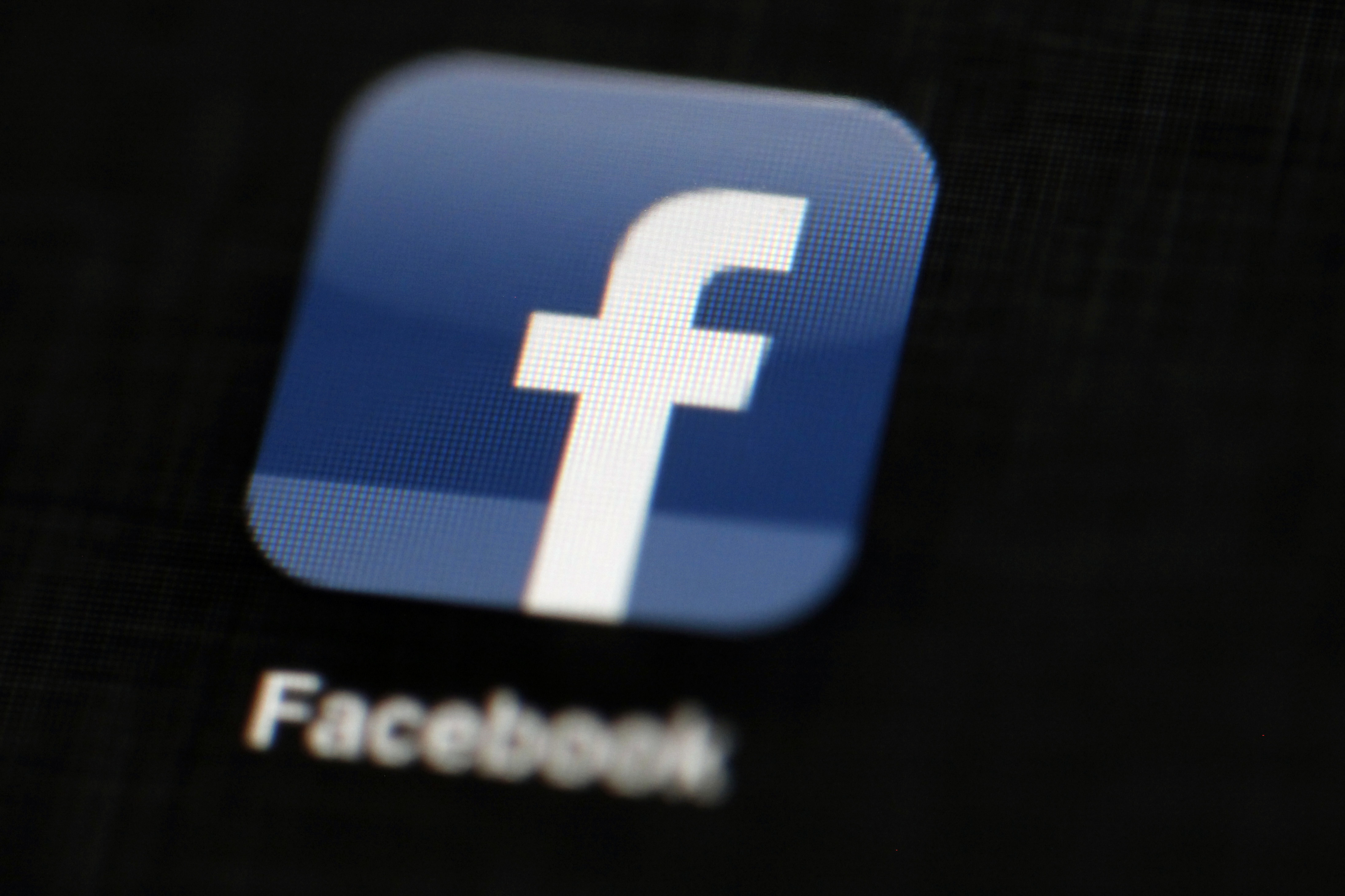 FILE - In this May 16, 2012, file photo, the Facebook logo is displayed on an iPad in Philadelphia. Facebook is taking new measures to curb the spread of fake news on its huge and influential social network, focusing on the "worst of the worst" offenders and partnering with outside fact-checkers to sort honest news reports from made-up stories that play to people's passions and preconceived notions. (AP Photo/Matt Rourke, File) (AP)