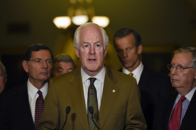 FILE- In this Dec. 6, 2016, file photo, Senate Majority Whip Sen. John Cornyn, of Texas, speaks to the media after the Republican policy luncheon on Capitol Hill in Washington. Republicans are eagerly planning initial votes next month on dismantling President Barack Obama’s health care law. Cornyn said there will likely be a three-year gap between Congress’ votes to repeal Obama’s law and when that would actually kick in. “We’re not going to let anybody fall through the cracks,” Cornyn said. (AP Photo/Sait Serkan Gurbuz, File) (Associated Press)