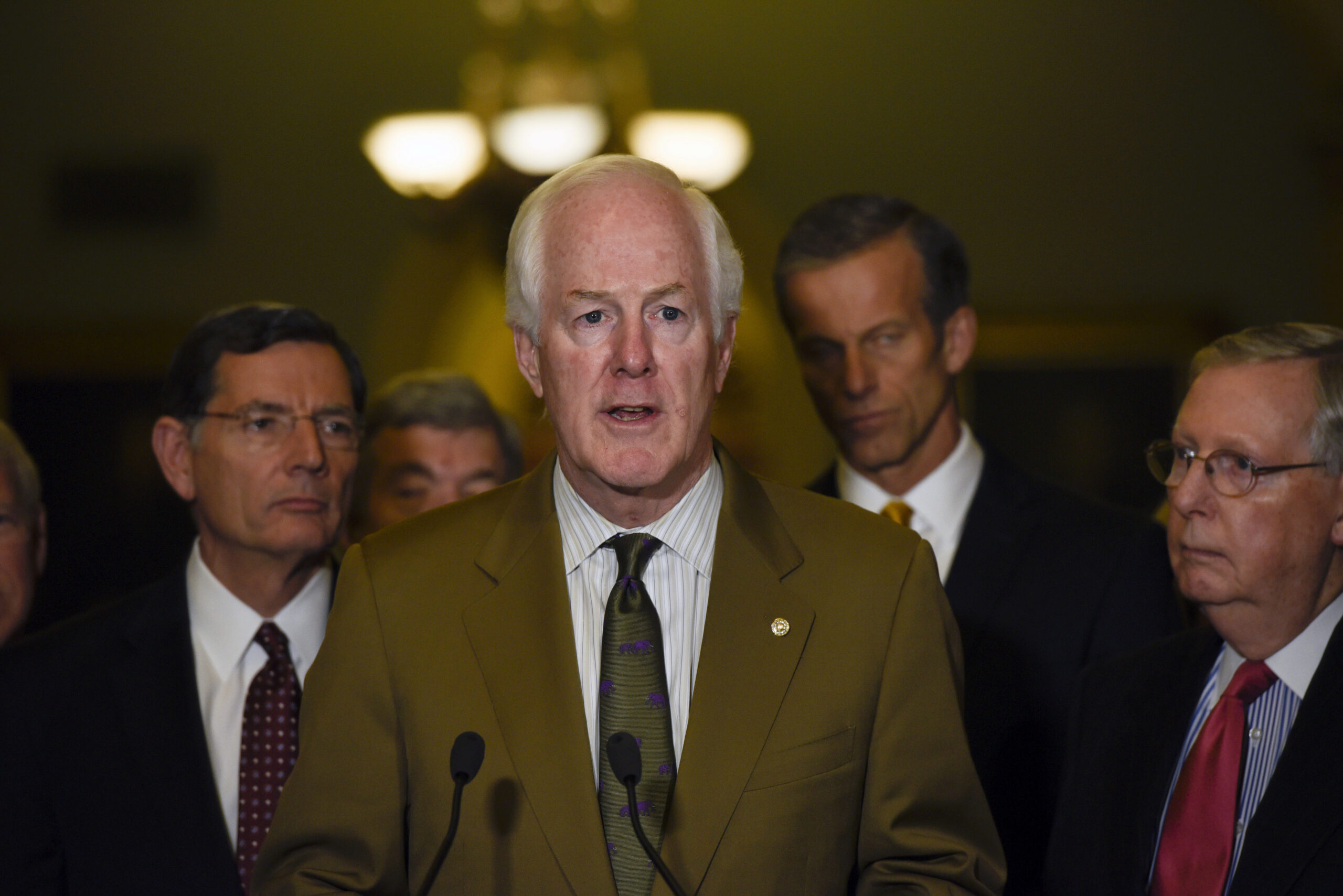 FILE- In this Dec. 6, 2016, file photo, Senate Majority Whip Sen. John Cornyn, of Texas, speaks to the media after the Republican policy luncheon on Capitol Hill in Washington. Republicans are eagerly planning initial votes next month on dismantling President Barack Obama’s health care law. Cornyn said there will likely be a three-year gap between Congress’ votes to repeal Obama’s law and when that would actually kick in. “We’re not going to let anybody fall through the cracks,” Cornyn said. (AP Photo/Sait Serkan Gurbuz, File) (Associated Press)