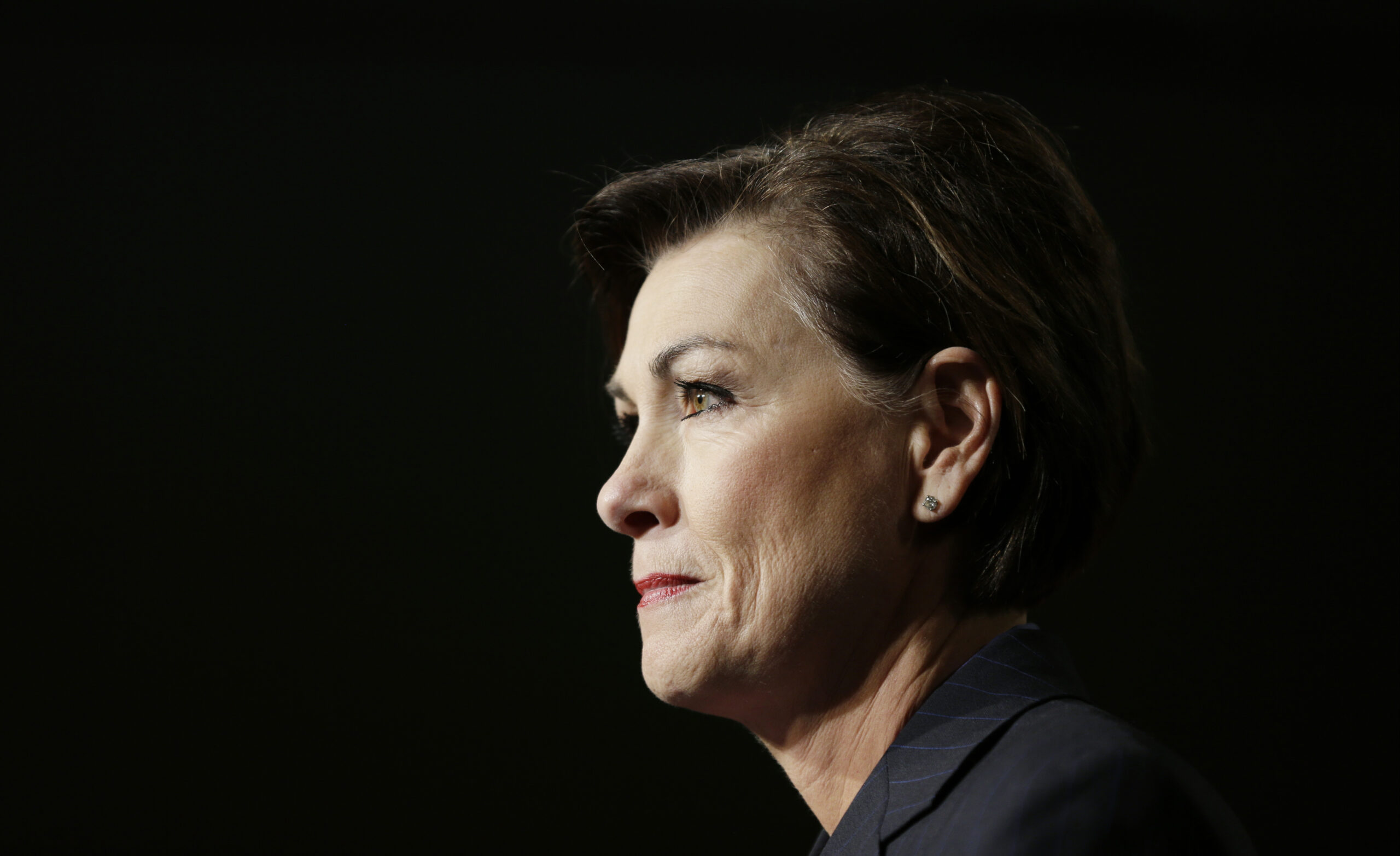 FILE - In this Jan. 15, 2014 file photo, Iowa Lt. Gov. Kim Reynolds speaks to supporters before introducing Iowa Gov. Terry Branstad at a rally in West Des Moines, Iowa. Reynolds, presumptively the next governor of Iowa, faces a renewed spotlight amid her sudden rise to the state's top job. Gov. Terry Branstad's plans to be a diplomat in President-elect Donald Trump's administration means attention will soon zero in on Reynolds, who could play a pivotal role in a GOP-majority statehouse that's itching to pass conservative legislation long derailed by Democrats. (AP Photo/Charlie Neibergall, File) (AP)