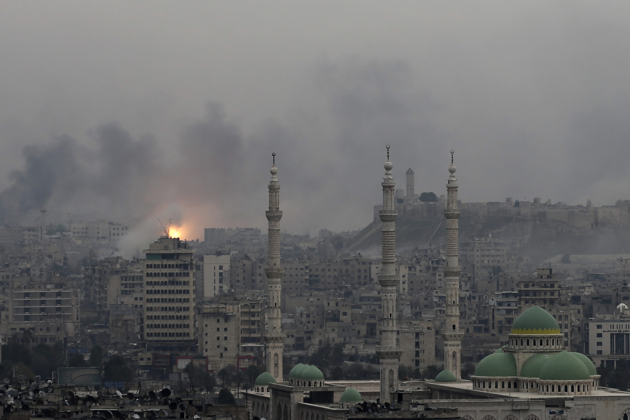 FILE -- In this Monday, Dec. 5, 2016 file photo, a ball of fire rises following an air strike hits insurgents positions in eastern neighborhoods of Aleppo, Syria. Aleppo shakes with explosions and gunfire day and night in both the government and rebel sides. But for supporters of President Bashar Assad at least, there is comfort in the growing sense of imminent victory in the city. A rebel defeat in Aleppo, Syria’s largest city and former commercial center, is likely to reverberate across the war-torn country, where opposition forces continue to hold out in smaller, more disconnected areas. (AP Photo/Hassan Ammar, File) (AP)