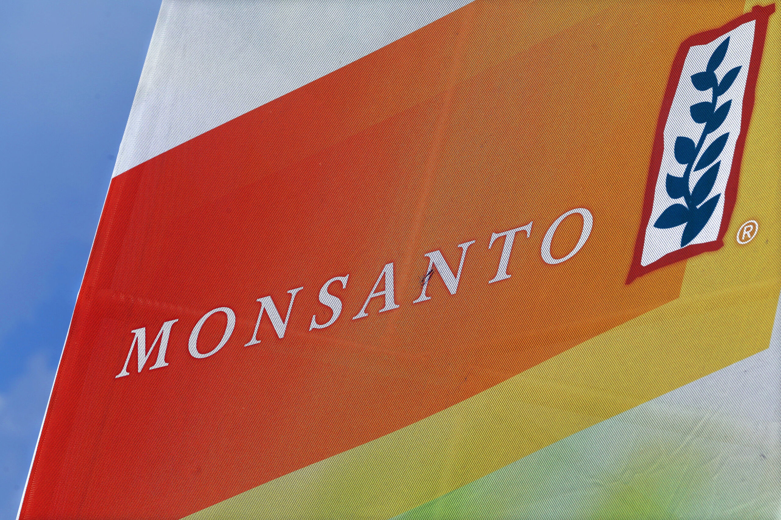 FILE - This Aug. 31, 2015, file photo, shows the Monsanto logo on display at the Farm Progress Show in Decatur, Ill. On Tuesday, Dec. 13, 2016, Monsanto Co. shareholders approved a $57 billion merger with Bayer AG, a deal that would combine two of the world's biggest agricultural companies. (AP Photo/Seth Perlman, File) (AP)