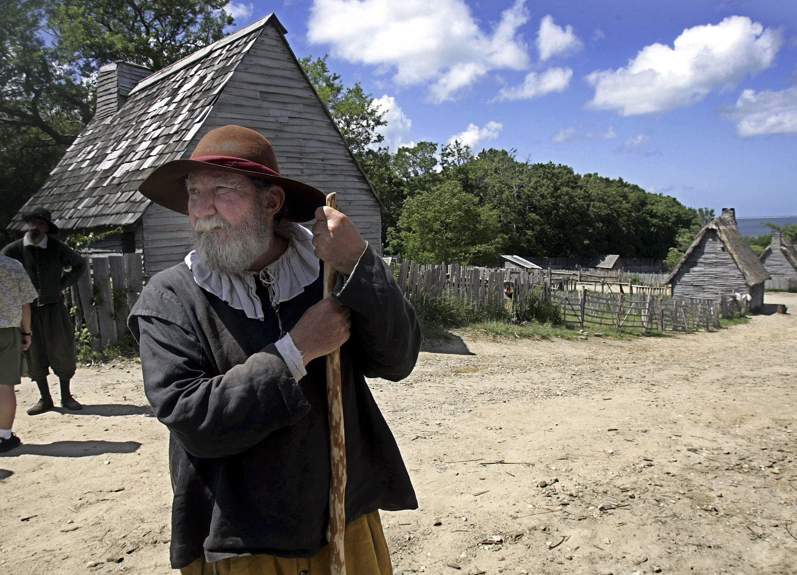 This June 27, 2006, file photo, shows a 17th century costumed role player, who called himself Samuel Fuller, in a 1627 Pilgrim Village at Plimoth Plantation in Plymouth, Mass. (AP Photo/Chitose Suzuki, File)