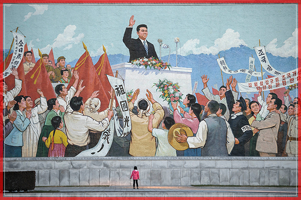 TOPSHOT - A child stands before a propaganda mosaic in Pyongyang on December 1, 2016.
The United Nations Security Council unanimously imposed its toughest sanctions on North Korea, placing a cap on the hermit state's key coal exports after its defiant nuclear tests. / AFP / Ed JONES        (Photo credit should read ED JONES/AFP/Getty Images) (Afp/getty Images)