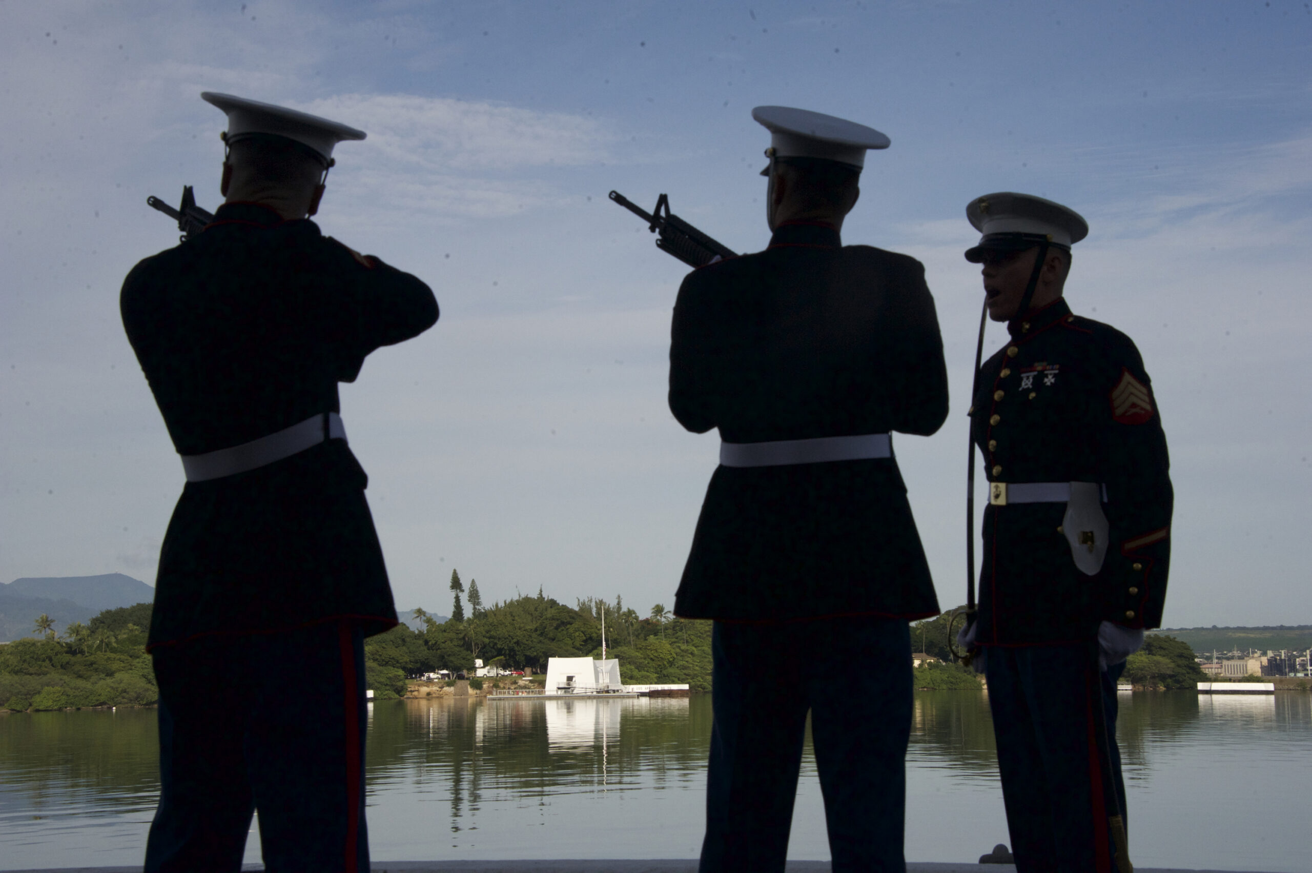 Marines fire their rifles during Rifle Salute during a commemoration for the 75th anniversary of the Japanese attack on the naval harbor on Wednesday, Dec. 7, 2016 at Kilo Peir in Honolulu. (Craig T. Kojima/The Star-Advertiser via AP, Pool) (AP)