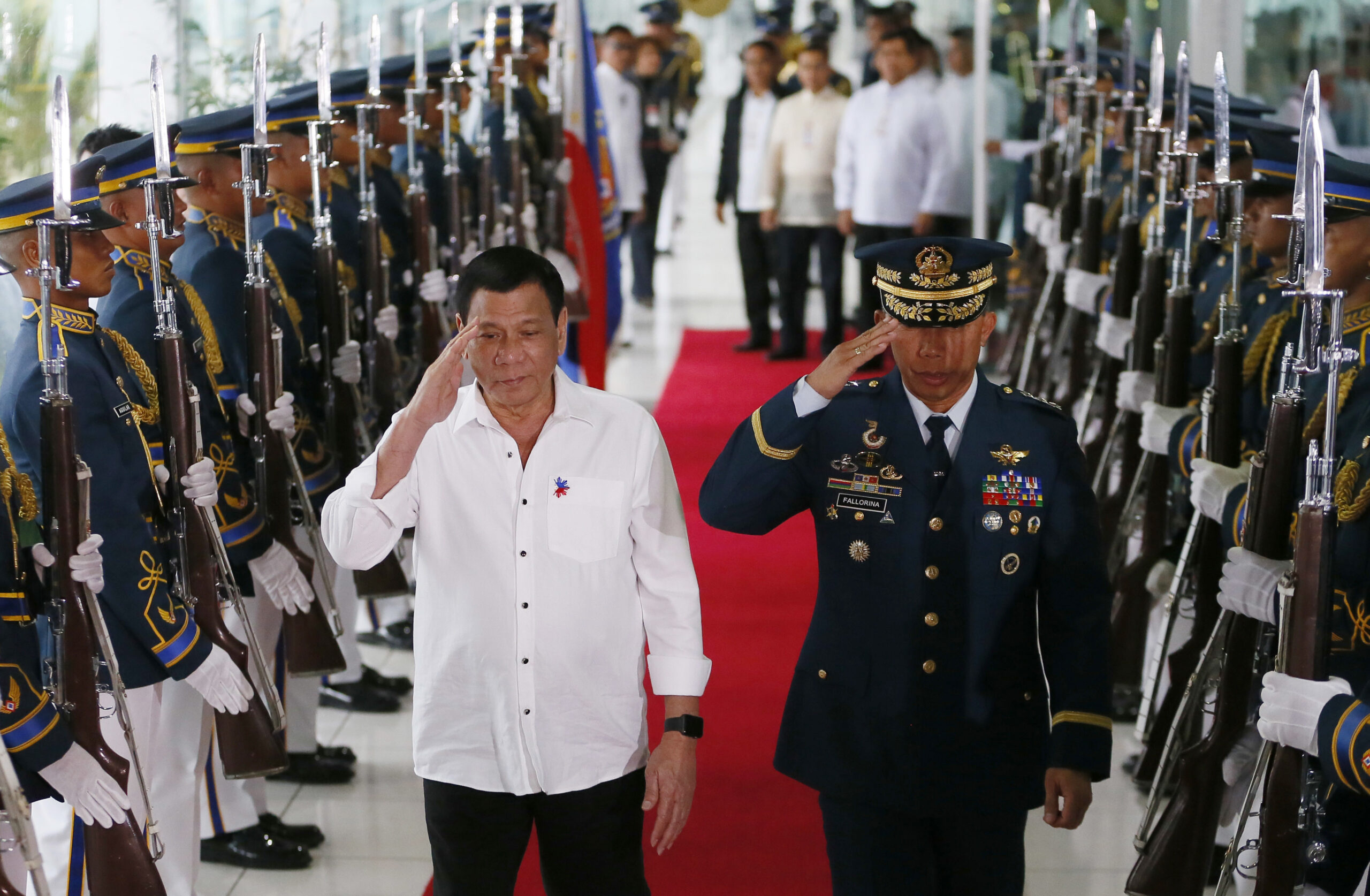 Philippine President Rodrigo Duterte salutes the honor guard prior to his departure for Cambodia and Singapore for official visits to the  ASEAN neighbors, Tuesday, Dec. 13, 2016 at the Ninoy Aquino International Airport in suburban Pasay city south of Manila, Philippines. Duterte said his trip to ASEAN neighbors is in preparation for the upcoming ASEAN summits which the Philippines is hosting late next year. (AP Photo/Bullit Marquez) (AP)