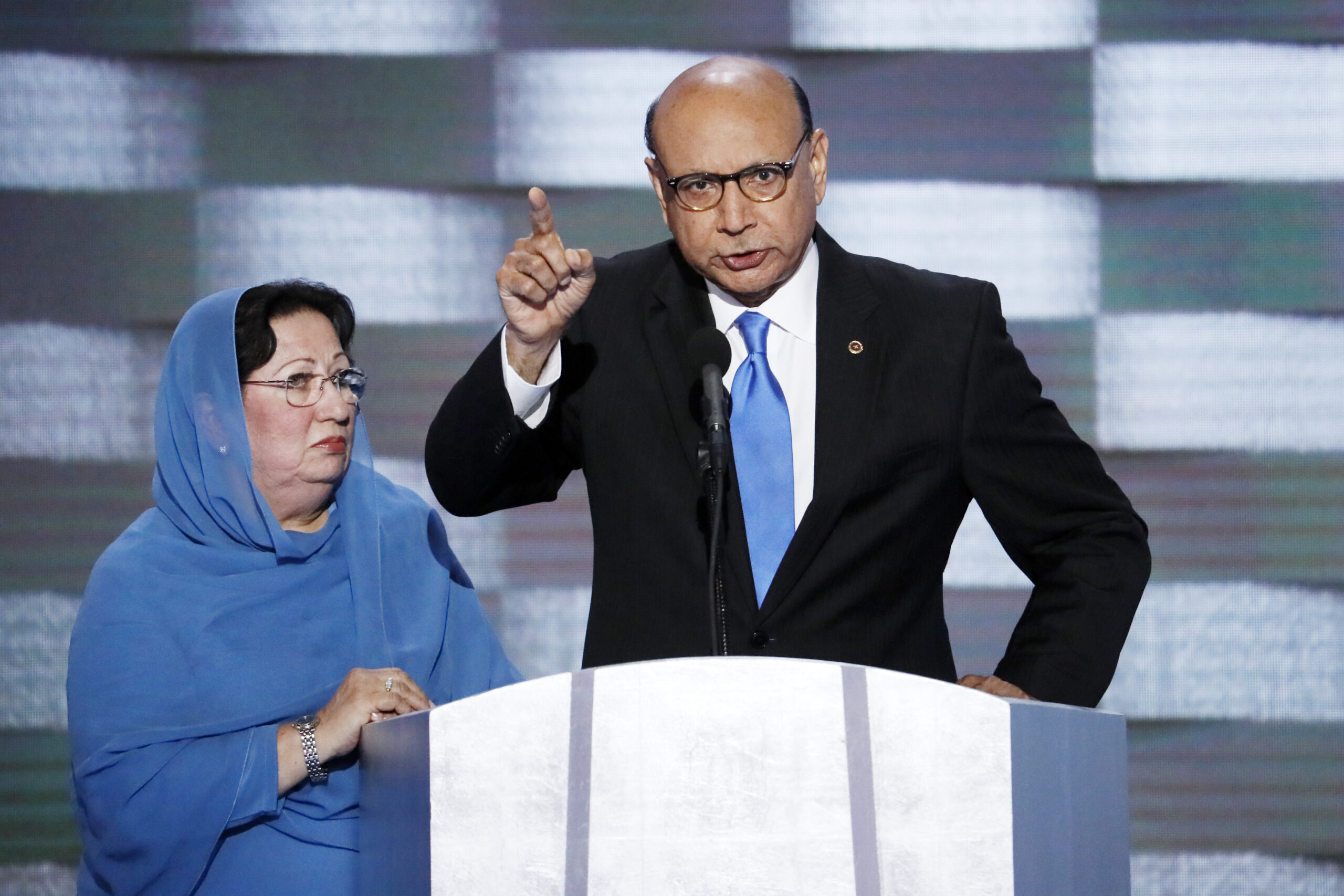 FILE- In this July 28, 2016, file photo, Khizr Khan, father of fallen US Army Capt. Humayun S. M. Khan speaks as his wife Ghazala listens during the final day of the Democratic National Convention in Philadelphia. Khizr Khan's address to Trump at the convention saying: "Have you even read the United States Constitution? ... You have sacrificed nothing and no one," was on Yale Law School librarian’s list of the most notable quotes of 2016. (AP Photo/J. Scott Applewhite, File) (AP)