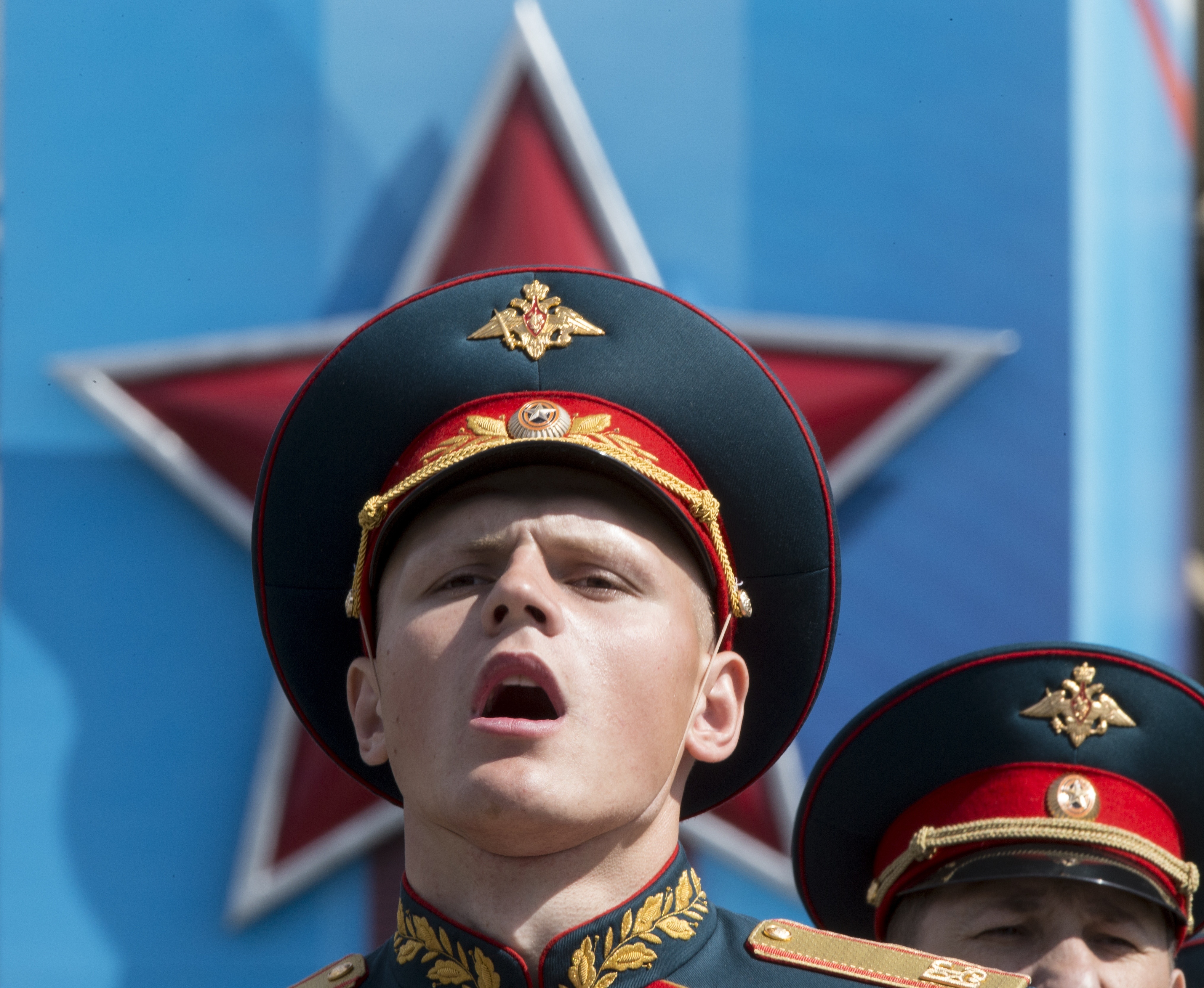 FILE In this file photo taken on Saturday, May 7, 2016, a Russian soldier sings in Red Square during a rehearsal for the Victory Day military parade which will take place at Moscow's Red Square on May 9 to celebrate 71 years after the victory in WWII in Moscow, Russia. (AP)