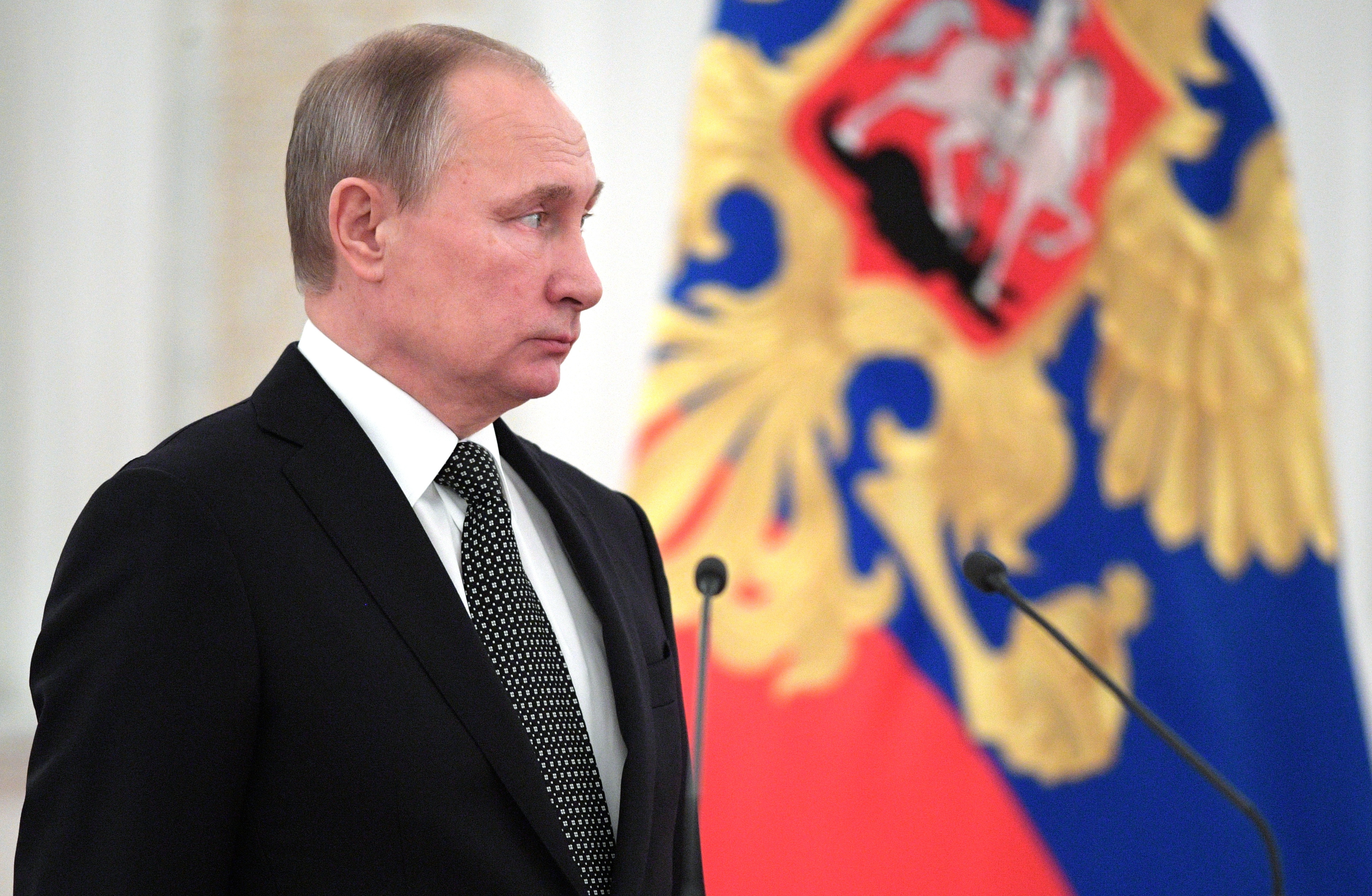 Russian president Vladimir pauese, prior to a meeting with newly appointed senior military staff in the Kremlin, in Moscow, Russia, Wednesday, Dec. 7, 2016. Putin on Wednesday paid respects to Russian medics and a colonel who died while on duty in Syria. (Alexei Druzhinin/Sputnik, Kremlin Pool Photo via AP) (AP)