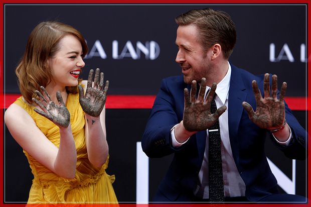 Actors Emma Stone and Ryan Gosling show their hands after placing them in cement during a ceremony in the forecourt of the TCL Chinese theatre in Hollywood, California U.S., December 7, 2016.   REUTERS/Mario Anzuoni     TPX IMAGES OF THE DAY - RTSV5IS (Reuters)
