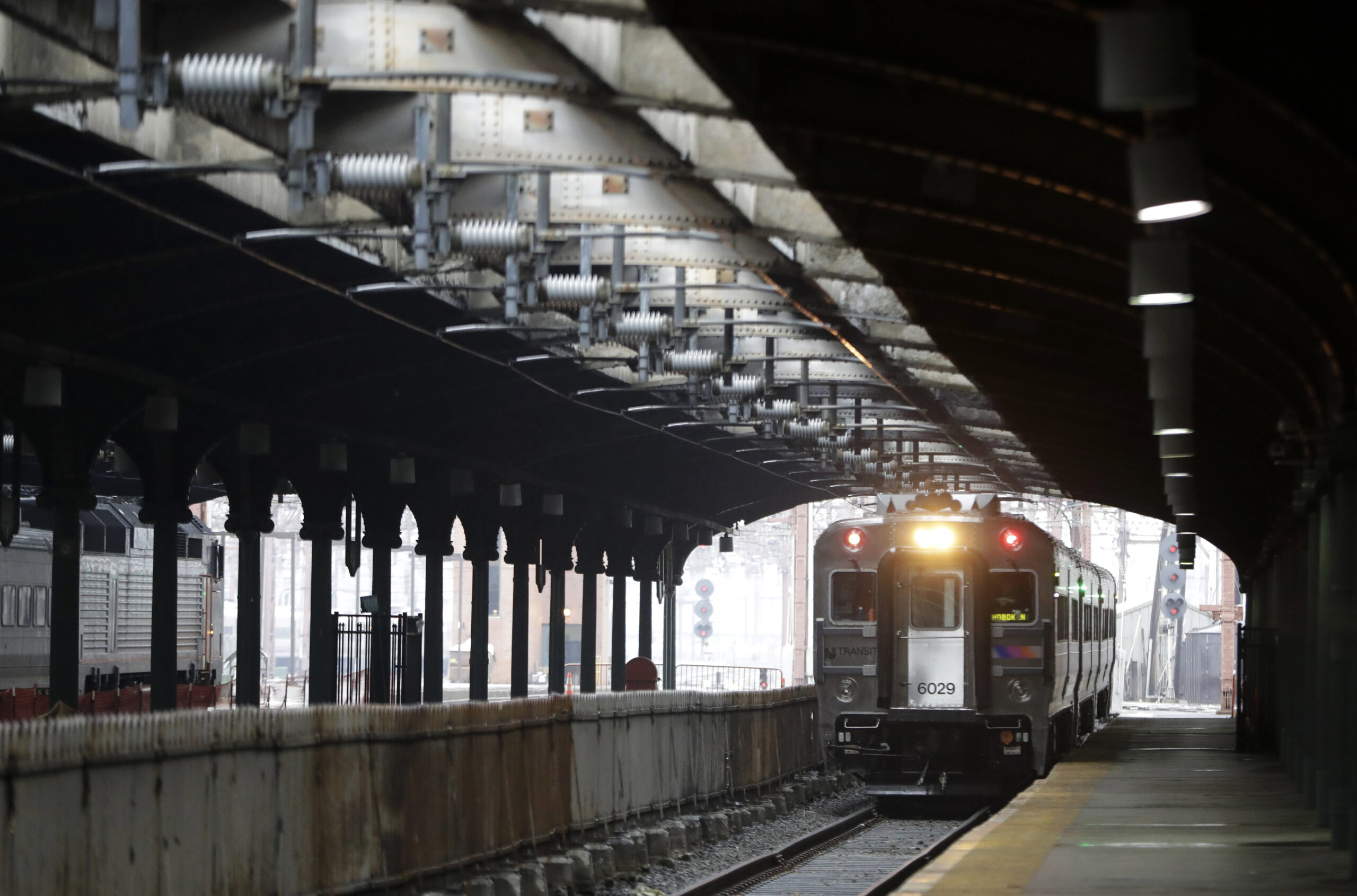 In a photograph taken Wednesday, Nov. 30, 2016, a New Jersey Transit train approaches the Hoboken Train Terminal on Track 4 in Hoboken, N.J. (AP Photo/Julio Cortez) (AP Photo/Julio Cortez)