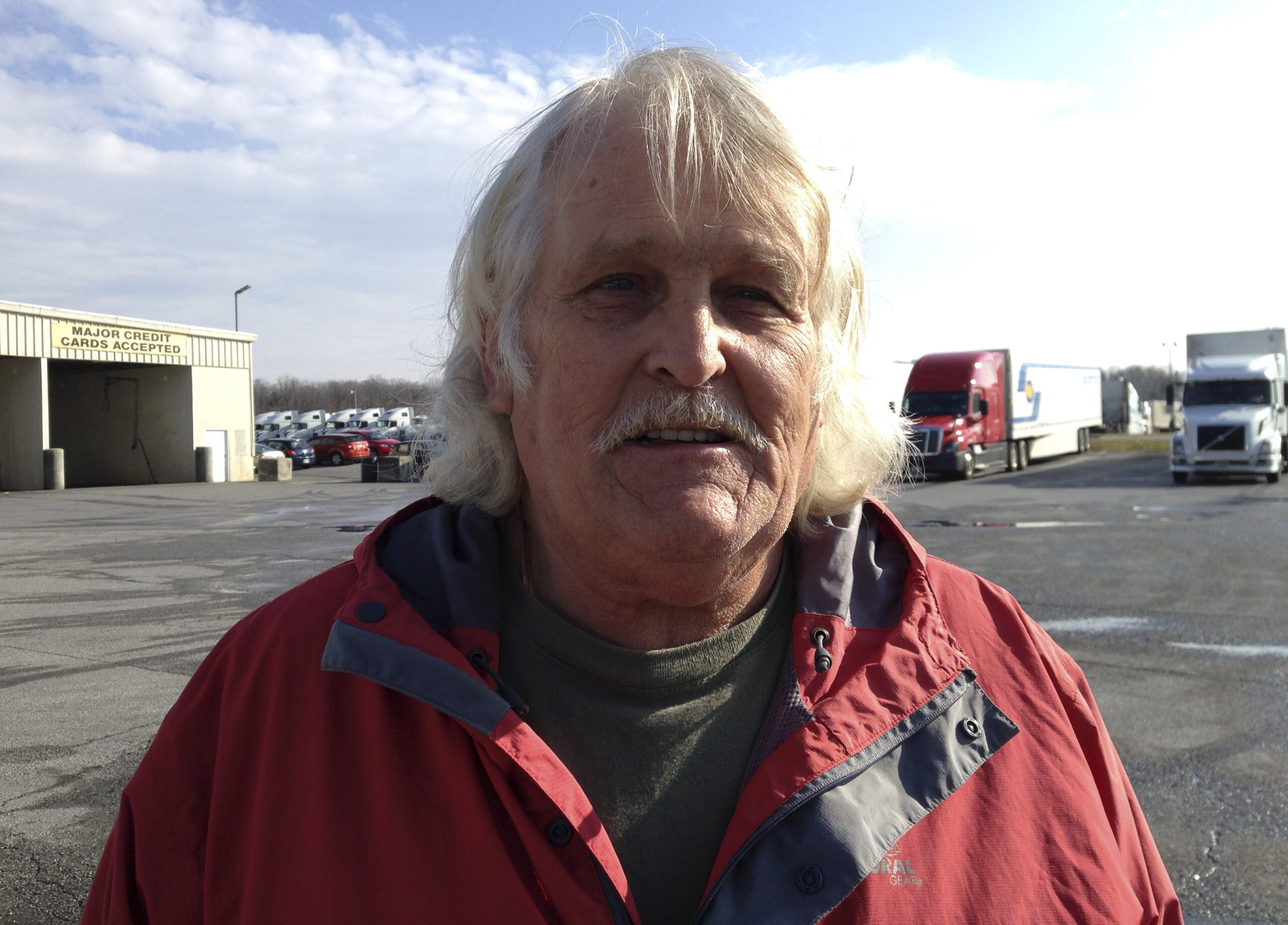 Truck driver Bill Varnado of Dallas, Ga., talks at a truck stop along Interstate 81 in Hagerstown, Md., on Wednesday, Dec. 7, 2016. He says he opposes Congress suspending a requirement for truckers to take two nights off to rest after a work week of up to 75 hours. He says the rule ensures that drivers get needed sleep. (AP Photo/David Dishneau) (AP)