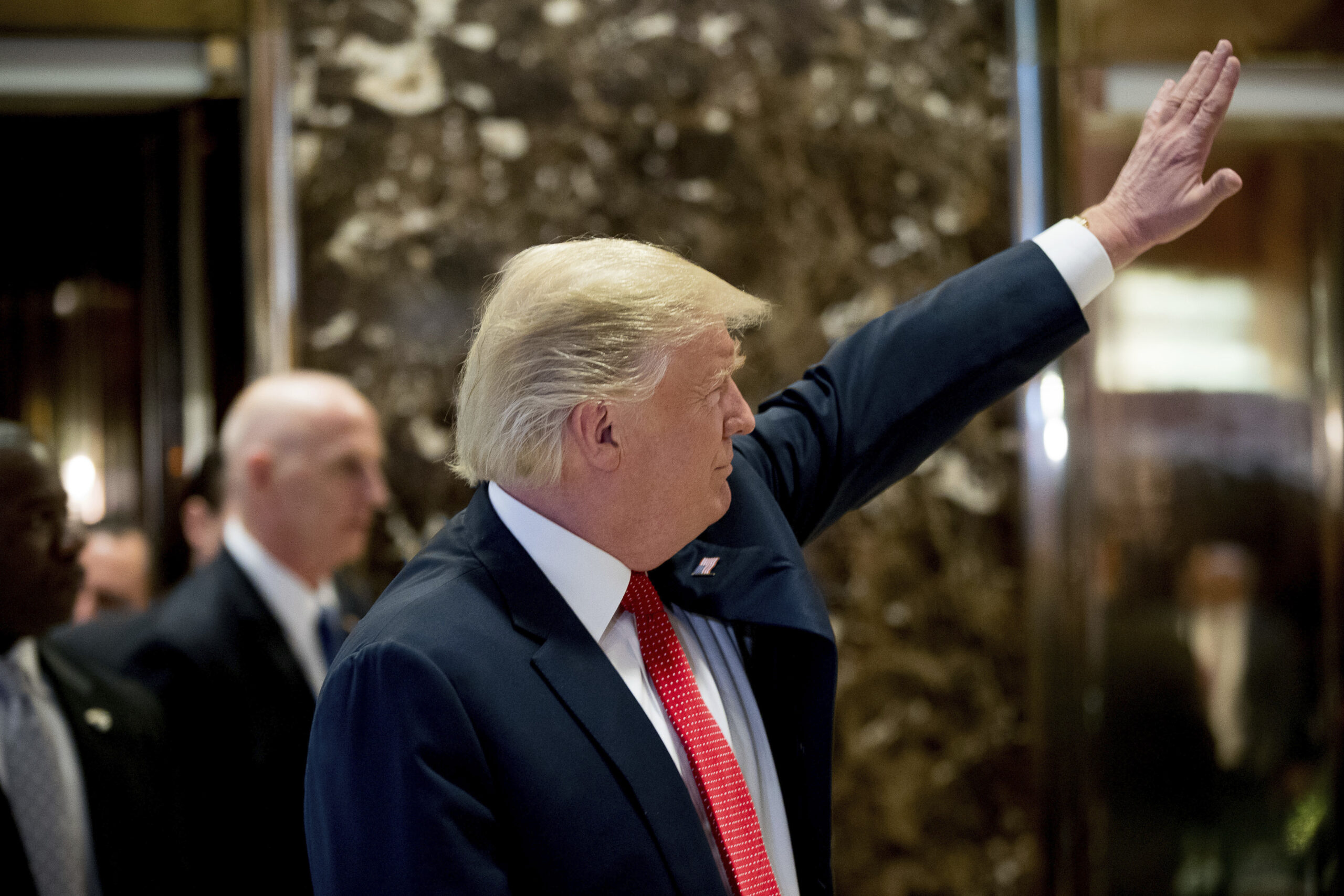 President-elect Donald Trump waves to visitors in the lobby of Trump Tower in New York, Tuesday, Dec. 6, 2016. (AP Photo/Andrew Harnik) (AP)
