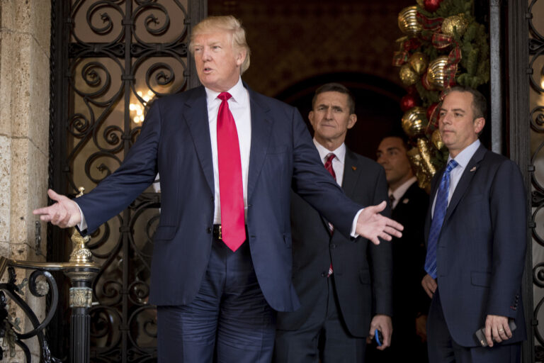 President-elect Donald Trump, left, accompanied by Trump Chief of Staff Reince Priebus, right, and Retired Gen. Michael Flynn, a senior adviser to Trump, center, speaks to members of the media at Mar-a-Lago, in Palm Beach, Fla., Wednesday, Dec. 21, 2016. (AP)