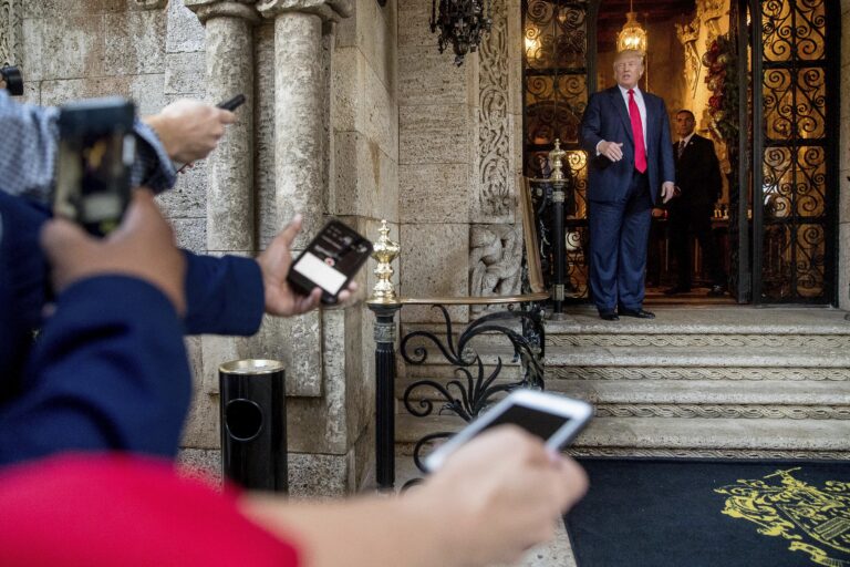 President-elect Donald Trump, right, speaks to members of the media after a meeting with admirals and generals from the Pentagon at Mar-a-Lago, in Palm Beach, Fla., Wednesday, Dec. 21, 2016. (AP Photo/Andrew Harnik) (AP)