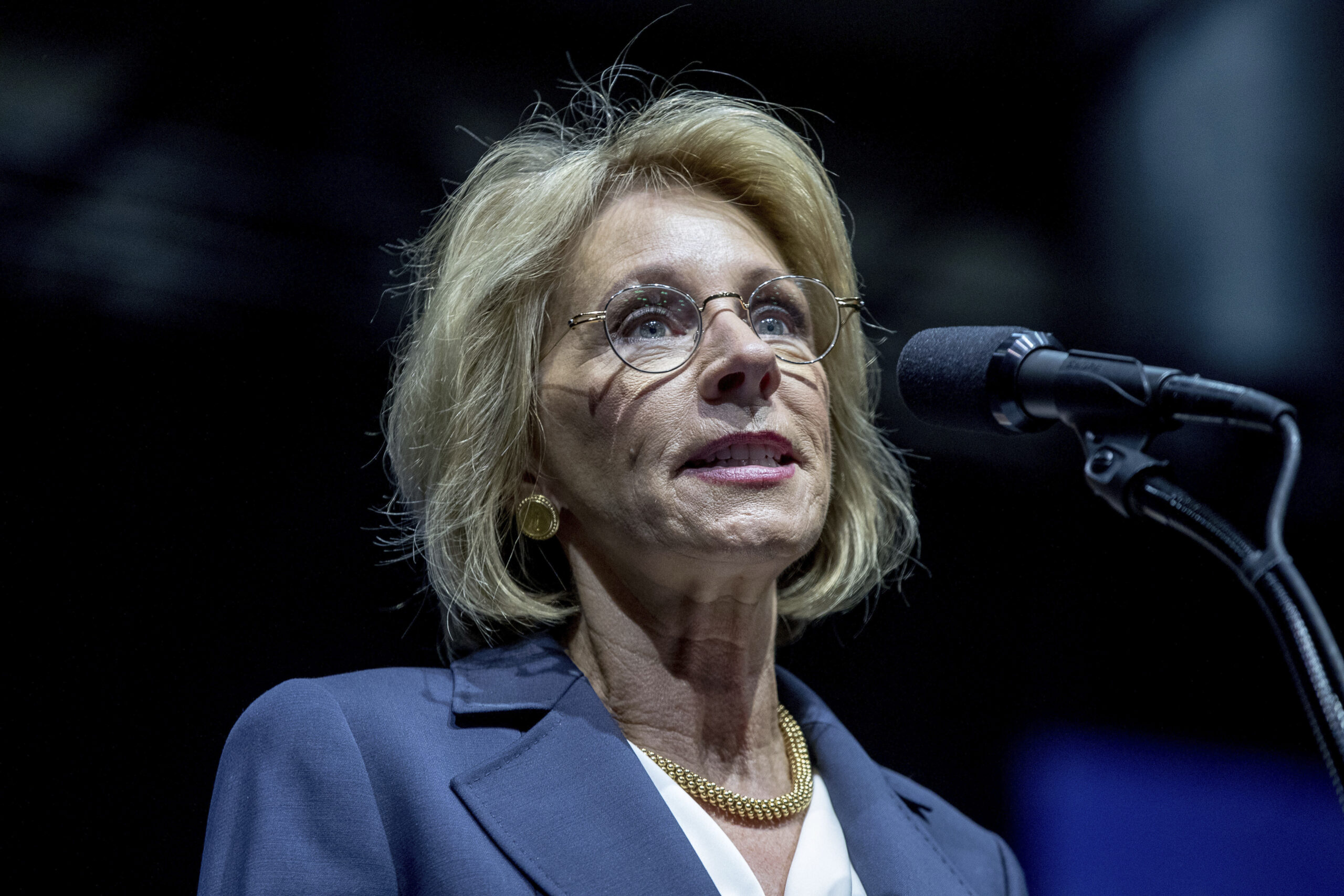 FILE - In this Dec. 9, 2016 file photo, Education Secretary-designate Betsy DeVos speaks in Grand Rapids, Mich. Edging closer to completing his Cabinet, President-elect Donald Trump announced his choice of Montana Rep. Ryan Zinke as Interior secretary Thursday, picking a man who should fit smoothly into an administration favoring more energy drilling and less regulation. (AP Photo/Andrew Harnik, File) (AP)