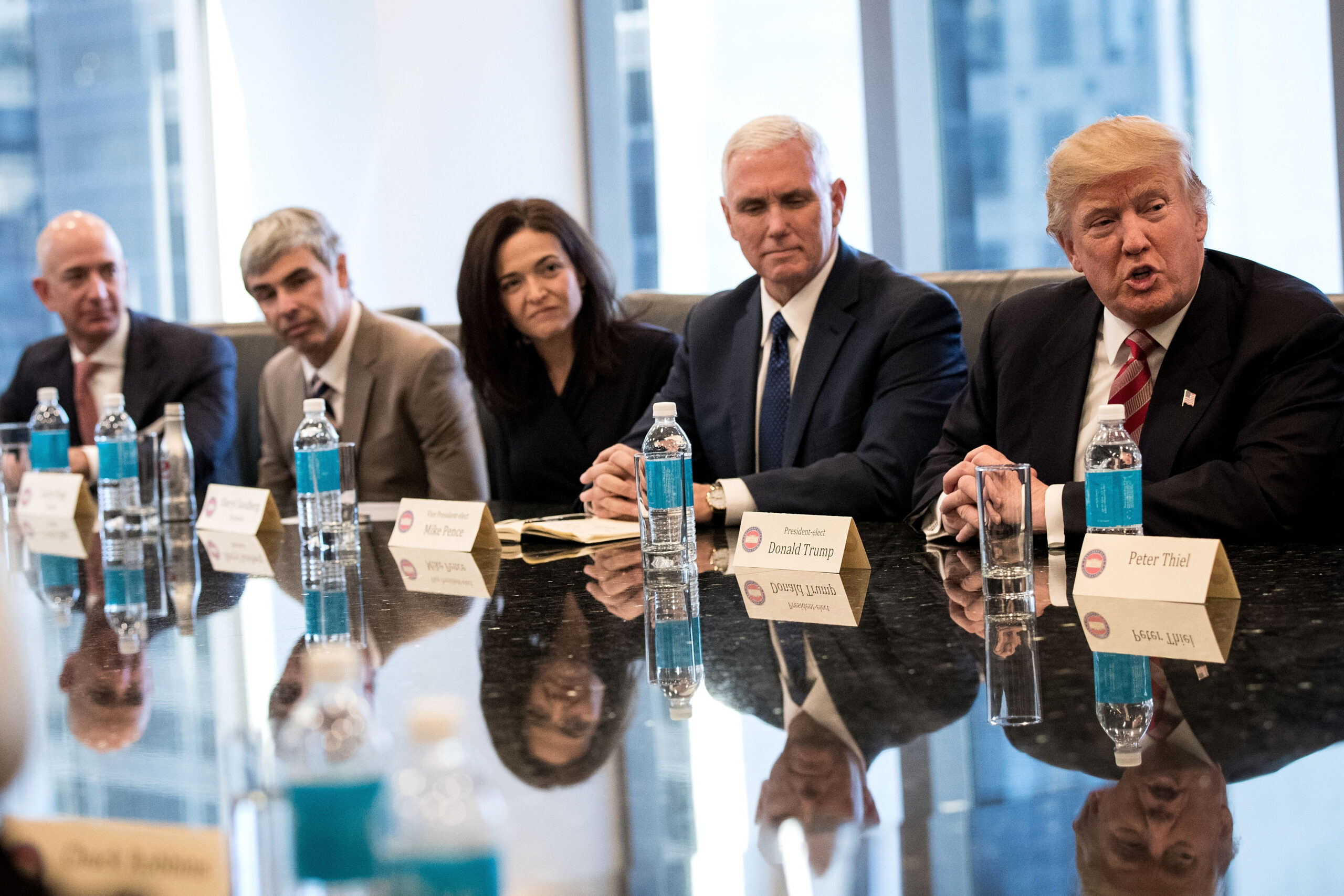 Jeff Bezos, chief executive officer of Amazon, Larry Page, chief executive officer of Alphabet Inc. (parent company of Google), Sheryl Sandberg, chief operating officer of Facebook,  Mike Pence and Donald Trump (Getty/Drew Angerer)