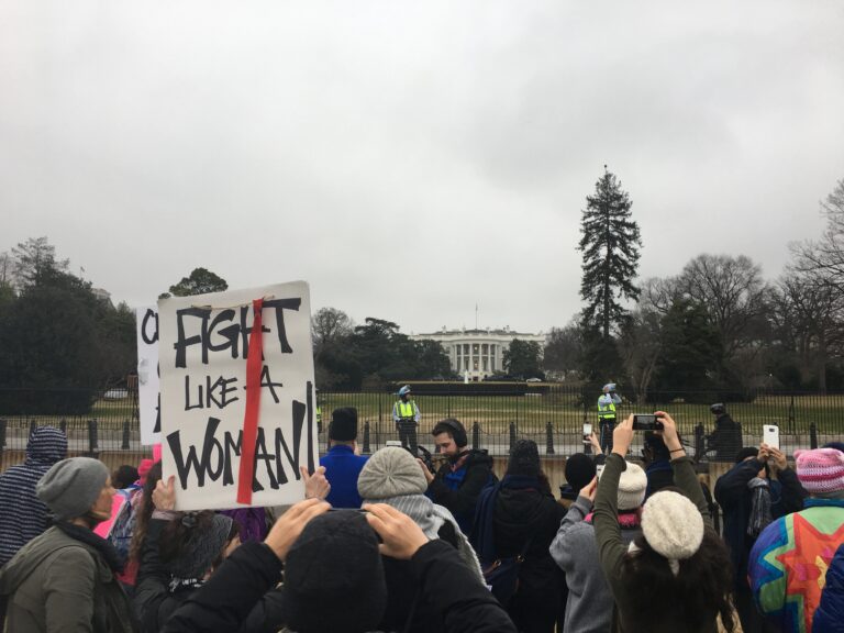 Protestors stand outside the White House at the end of Saturday's Women's March on Washington (Alli Joseph)
