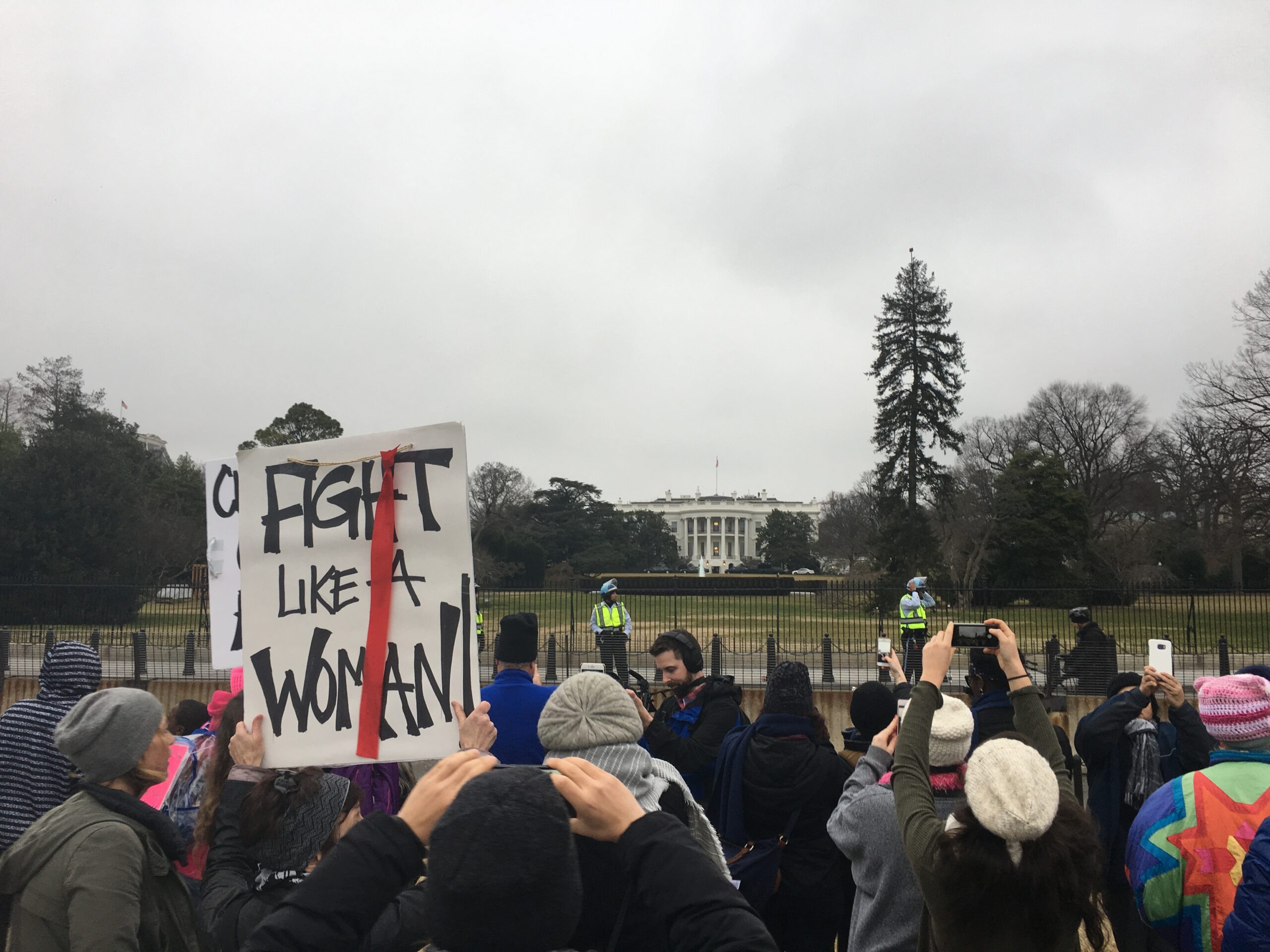 Protestors stand outside the White House at the end of Saturday's Women's March on Washington (Alli Joseph)