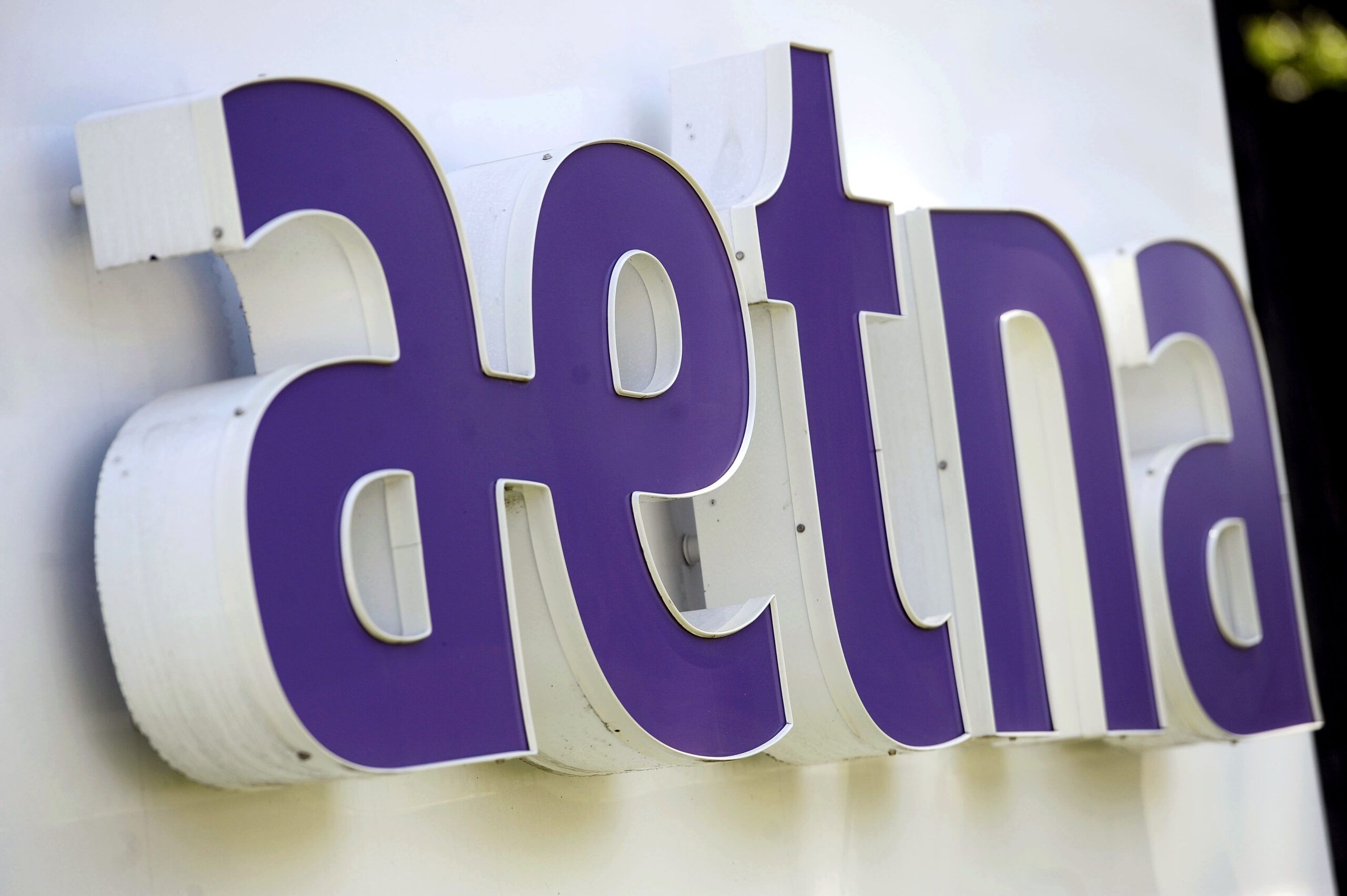 FILE - This Tuesday, Aug. 19, 2014, file photo, shows signage in front of Aetna Inc.'s headquarters in Hartford, Conn. A federal judge has rejected health insurer Aetna’s plan to buy rival Humana for about $34 billion and become a major player in the market for Medicare Advantage coverage. U.S. District Judge John Bates said in an opinion filed Monday, Jan. 23, 2017, that he largely agrees with federal regulators who contended that such a combination would hurt competition. (AP Photo/Jessica Hill, File) (AP)