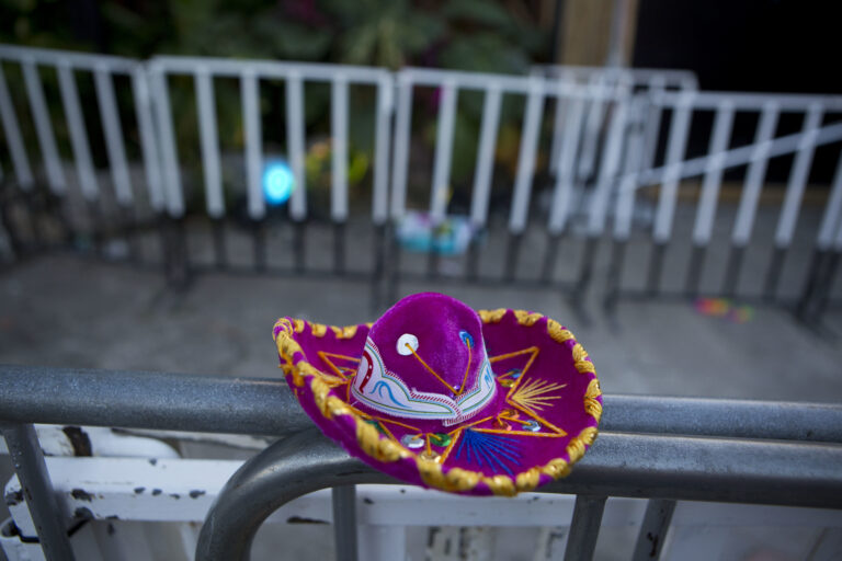 A Mexican tourist souvenir placed by a well-wisher sits on barriers blocking the entrance to the Blue Parrot club, where several people were killed in early morning gunfire, in Playa del Carmen, Mexico, Monday, Jan. 16, 2017. Deadly gunfire broke out in the crowded beachfront nightclub throbbing with electronic music before dawn on Monday, setting off a bloody stamped by screaming concertgoers at an international festival in this Caribbean resort.(AP Photo/Rebecca Blackwell) (AP)