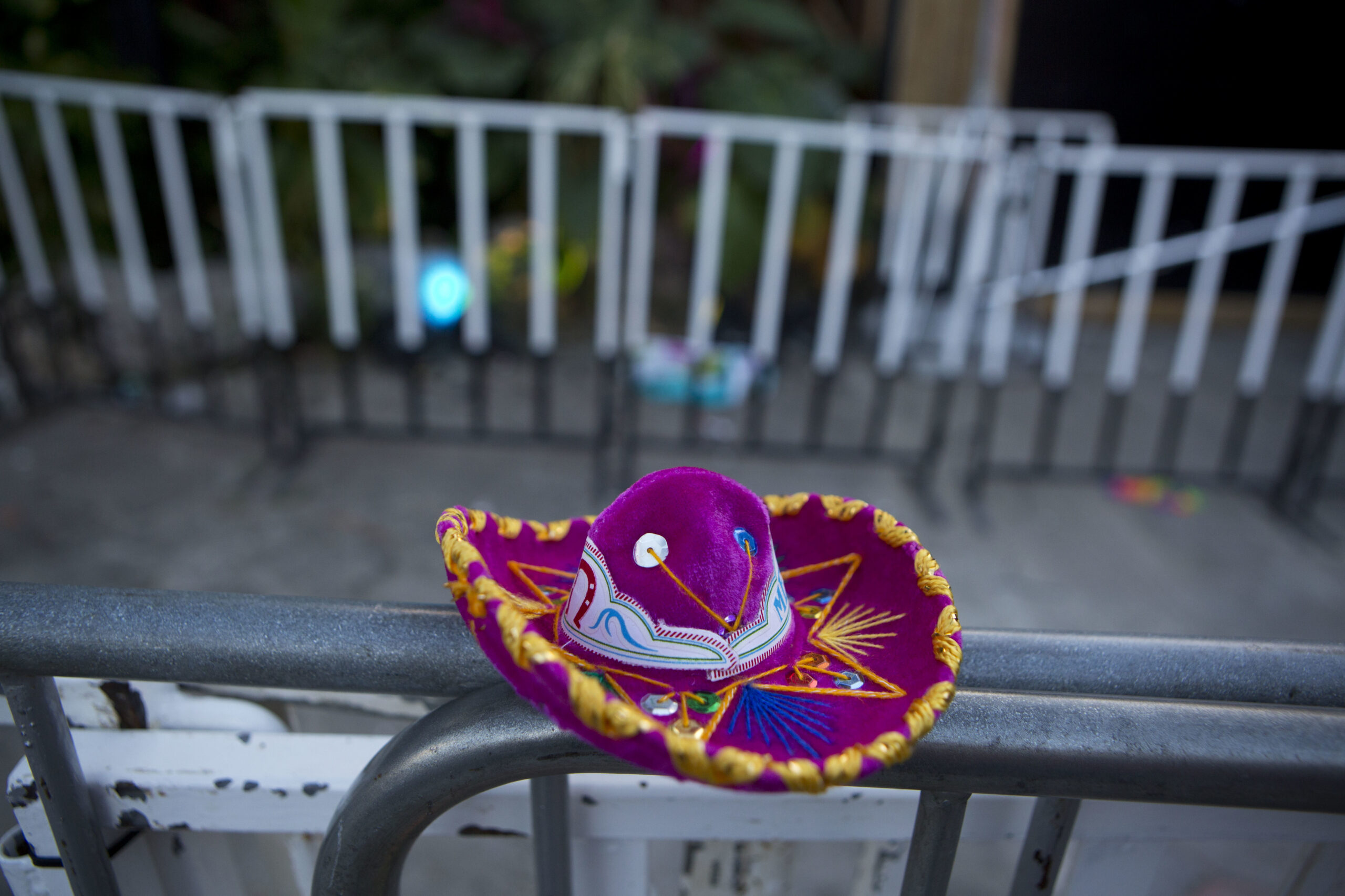 A Mexican tourist souvenir placed by a well-wisher sits on barriers blocking the entrance to the Blue Parrot club, where several people were killed in early morning gunfire, in Playa del Carmen, Mexico, Monday, Jan. 16, 2017. Deadly gunfire broke out in the crowded beachfront nightclub throbbing with electronic music before dawn on Monday, setting off a bloody stamped by screaming concertgoers at an international festival in this Caribbean resort.(AP Photo/Rebecca Blackwell) (AP)