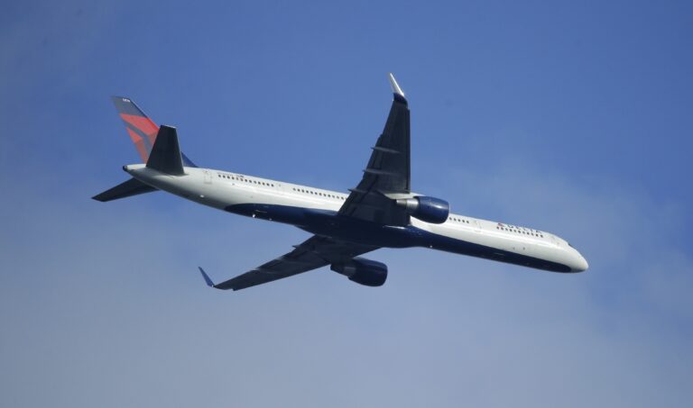 FILE - In this Sunday, March 6, 2016, file photo, a Delta Air Lines Boeing 757 flies overhead, in Seattle. On Thursday, Jan. 12, 2017, Delta Air Lines, Inc. reports financial results. (AP Photo/Ted S. Warren, File) (AP)