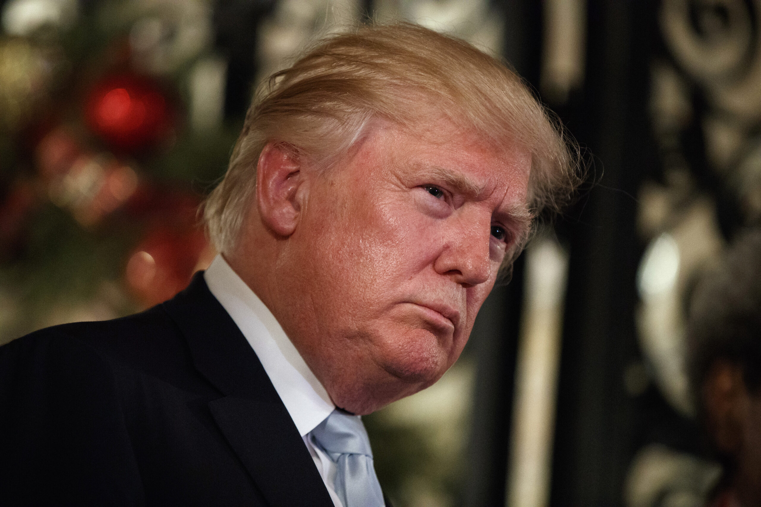 FILE -- In this Wednesday, Dec. 28, 2016 file photo, President-elect Donald Trump listens to a question as he speaks to reporters at Mar-a-Lago, in Palm Beach, Fla. The 18-hole golf course in Dubai bearing Donald Trump’s name exemplifies the questions surrounding his international business interests. The course will open in February 2017 in the United Arab Emirates, but concerns about security, financial agreements and other matters have yet to be answered by the incoming 45th American president. (AP Photo/Evan Vucci, File) (AP)