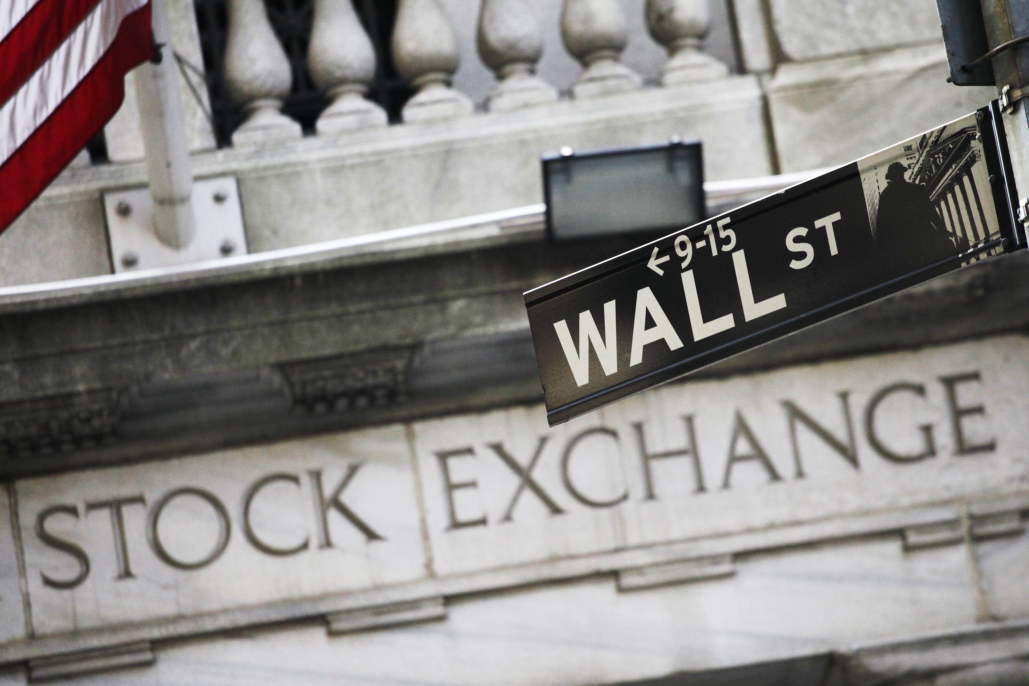 FILE - This July 16, 2013, file photo, shows a Wall Street street sign outside the New York Stock Exchange. The major U.S. stock indexes edged higher in early trading Wednesday, Jan. 11, 2017, as investors looked ahead to the start of corporate earnings reports later in the week. Energy stocks led the gainers as crude oil prices headed higher, while phone and real estate stocks lagged the most. () (AP Photo/Mark Lennihan, File)