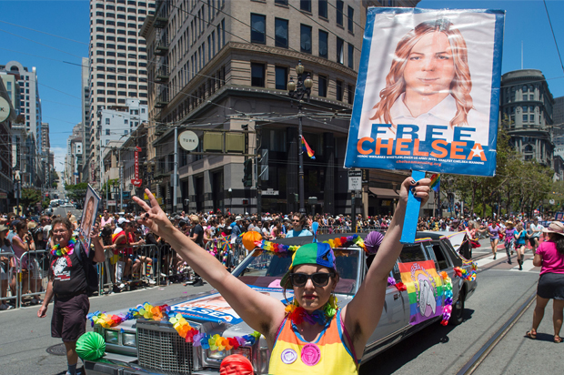 Protester holds up a sign advocating the release of WikiLeaks whistle blower Chelsea Manning along the Gay Pride parade route in San Francisco (Getty/Josh Edelson)