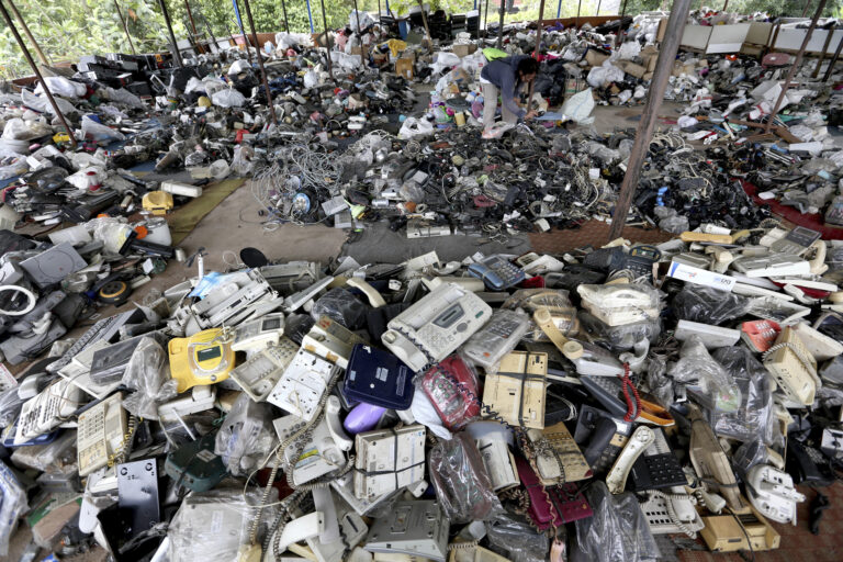 In this Friday, Jan. 13, 2017 photo, a customer browses through used items at a flea market on the outskirts of Jakarta, Indonesia. The waste from discarded electronic gadgets and electrical appliances has increased by two-thirds in East Asia over five years, posing a growing threat to health and the environment unless proper disposal becomes the norm. The United Nations University says China is the biggest culprit with its electronic waste more than doubling. (AP Photo/Tatan Syuflana) (AP)