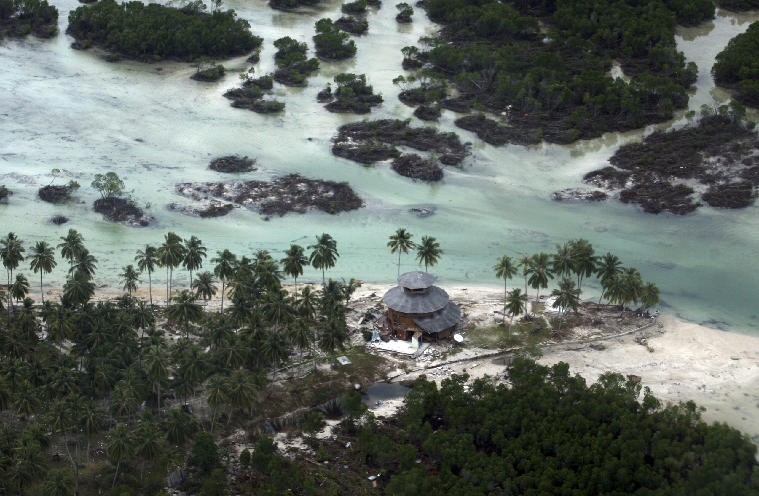 FILE- This Oct. 27, 2010 file photo shows an area ravaged by a tsunami on Mentawai island, Indonesia. Indonesia's tsunami detection system, made up of seafloor sensors that communicate with transmitting buoys on the surface, has been rendered useless by vandals and lack of funding. Now Indonesian and U.S. scientists say they’ve developed a way to dispense with the expensive buoys and possibly add crucial extra minutes of warning for vulnerable coastal cities. (AP Photo/Achmad Ibrahim, File) (AP)