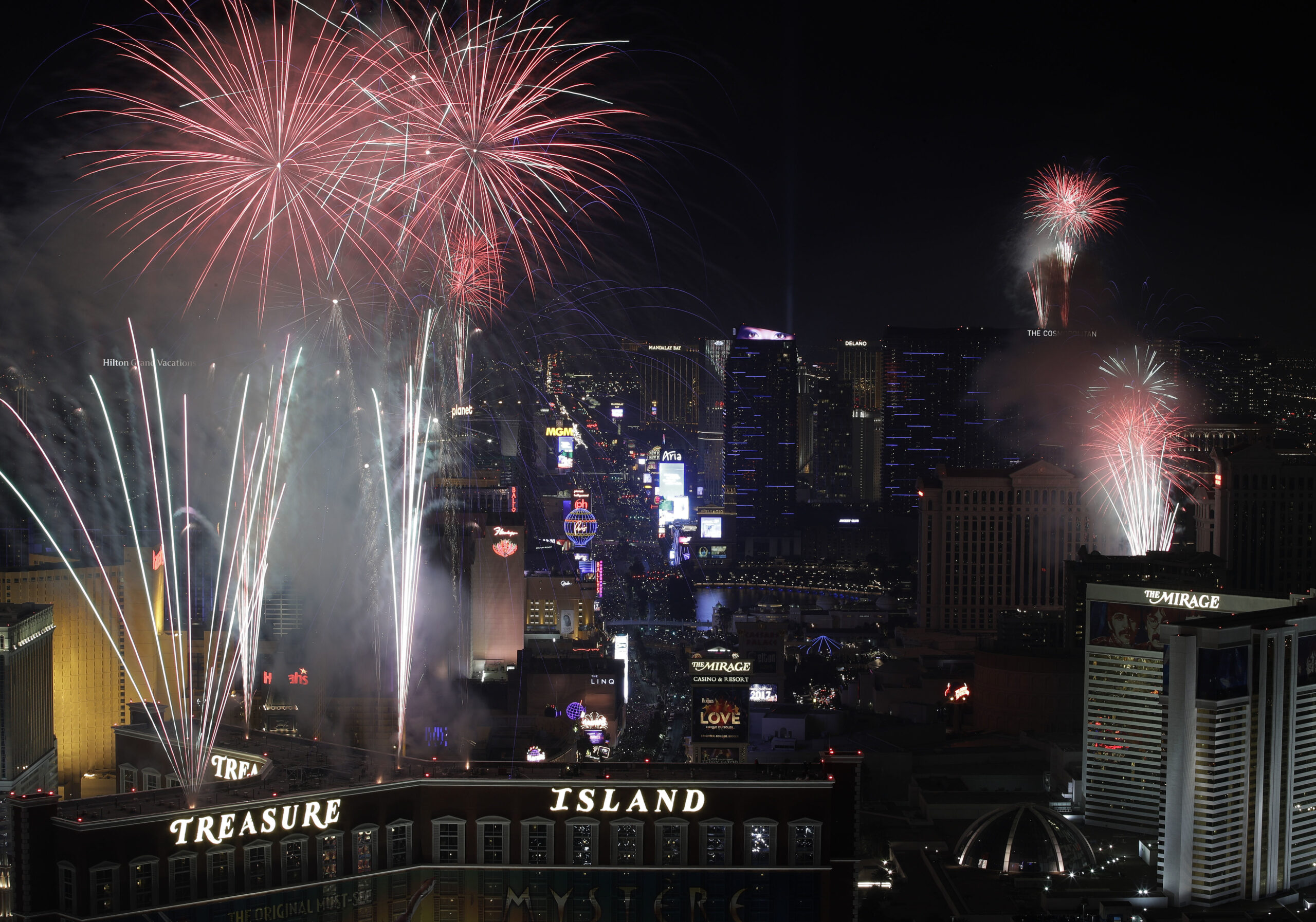 Fireworks explode over the Las Vegas Strip during a New Year's Eve celebration Sunday, Jan. 1, 2017, in Las Vegas. (AP Photo/John Locher) (AP)