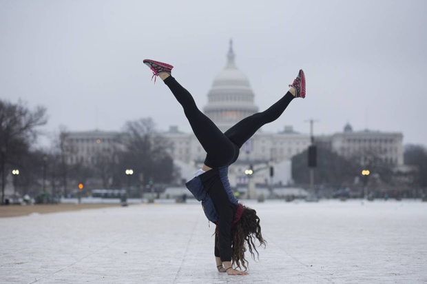 Yetta Stein from Portland does a handstand before the Women's March. (Peter Cooper/Salon)