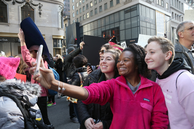 March goers take a selfie at the Women's March in New York, January 21, 2017. (Getty/Rob Kim)