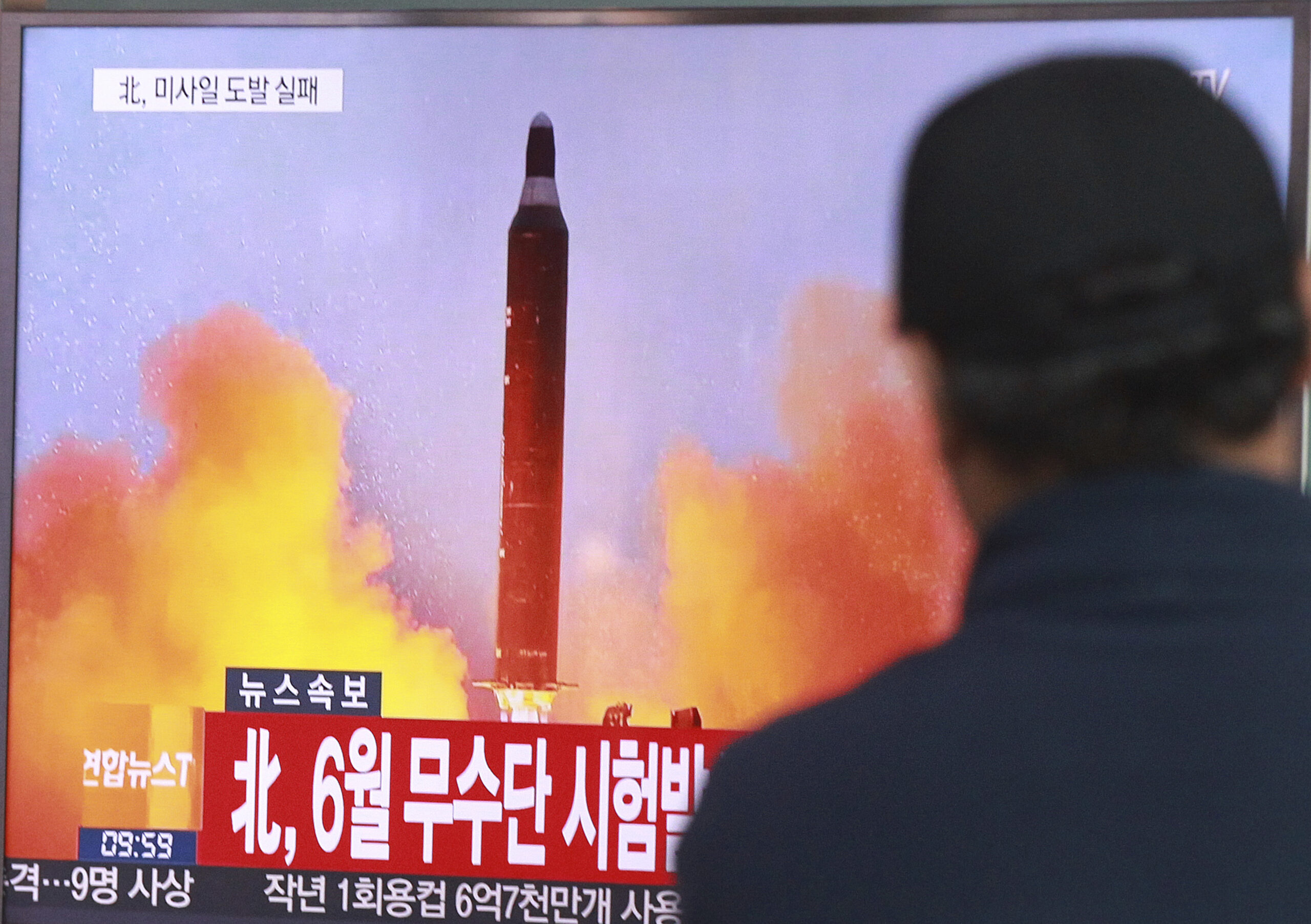 FILE - In this Oct. 16, 2016, file photo, a man watches a TV news program showing a file image of a missile launch conducted by North Korea, at the Seoul Railway Station in Seoul, South Korea. U.S. President-elect Donald Trump took to Twitter on Tuesday, Jan. 3, 2017, to vow that North Korea’s push to develop a nuclear weapon capable of reaching parts of the United States “won’t happen.” It may already have. The letters read "North attempted to fire a mid-range Musudan missile in June." (AP Photo/Ahn Young-joon, File) (AP)